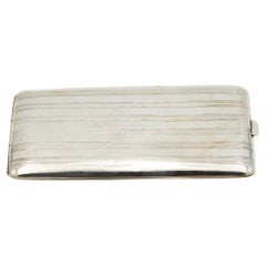 Rectangular silver cigarette case with engraved strips