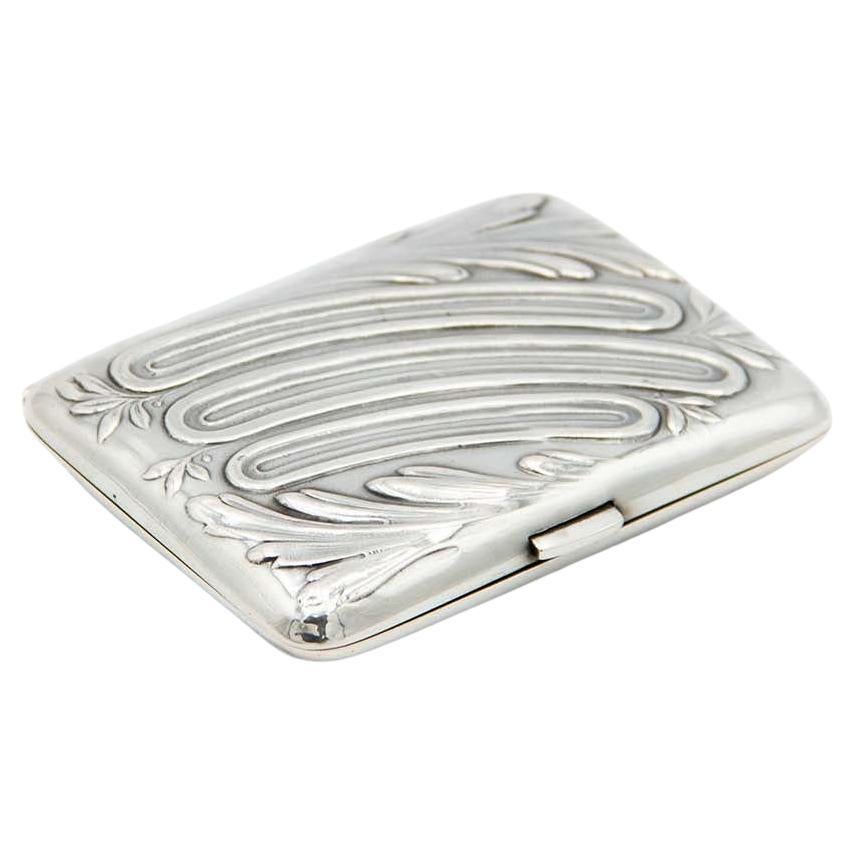 Rectangular silver cigarette case with floral motifs