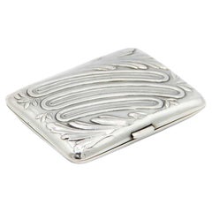 Rectangular silver cigarette case with floral motifs