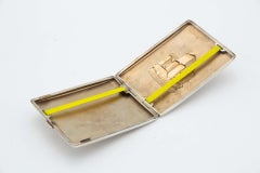 Rectangular silver cigarette case with high reliefs