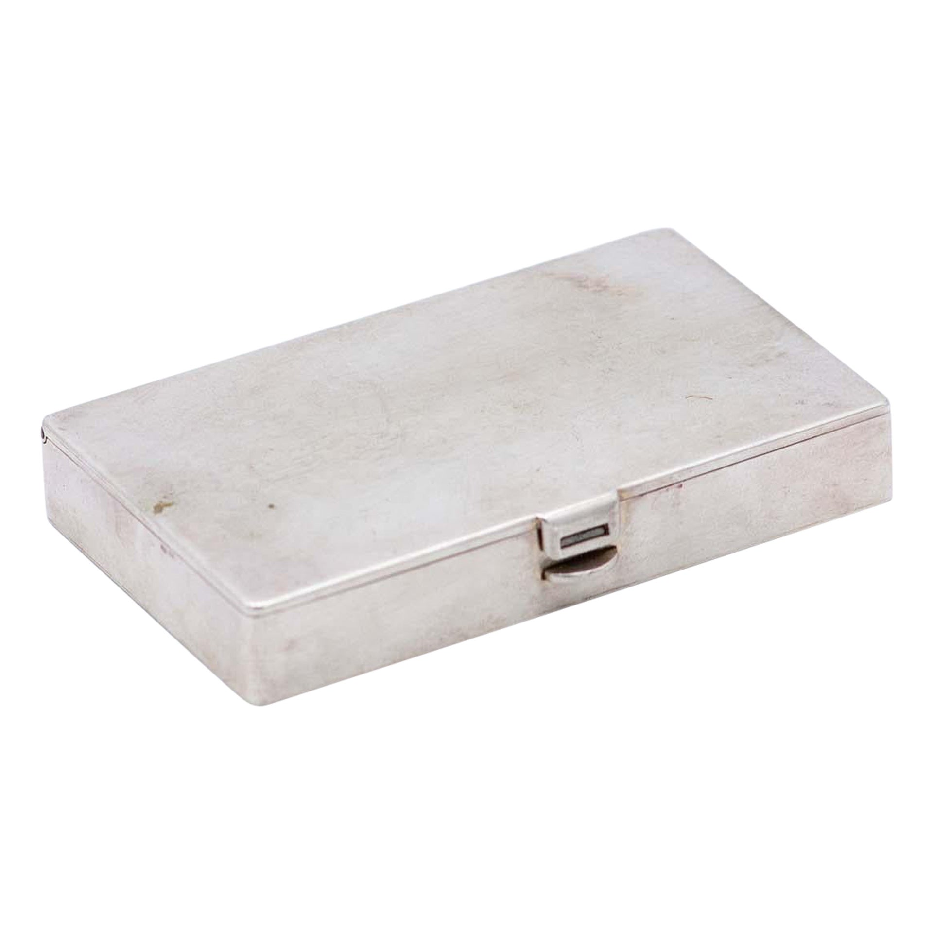 Rectangular silver stamp/match box with gold interior and spring clasp