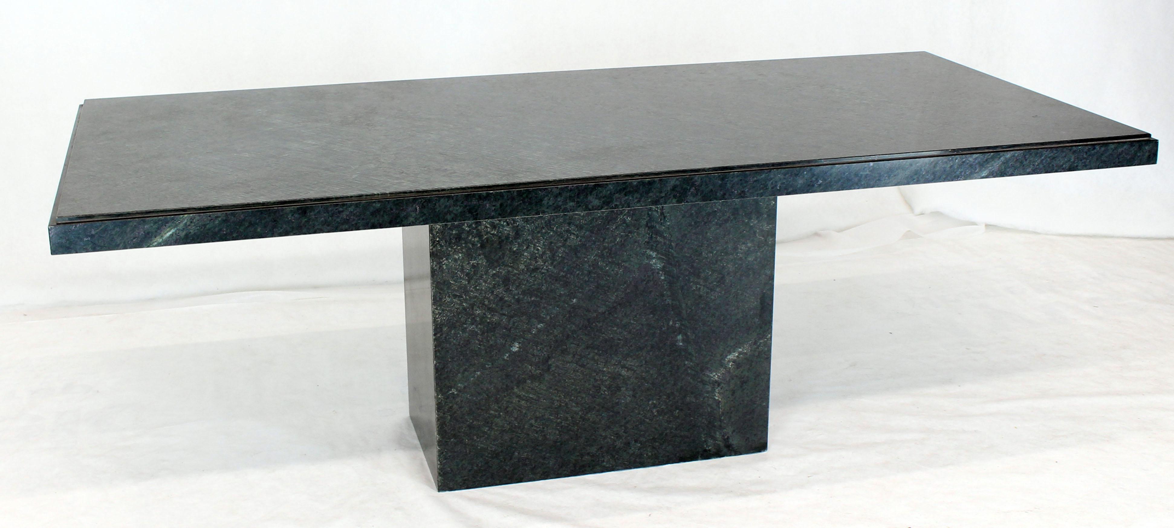 Mid-Century Modern simple lined single rectangle marble pedestal and top dining conference table. 
The color is very dark emerald green almost black depending of the lighting angle.
 