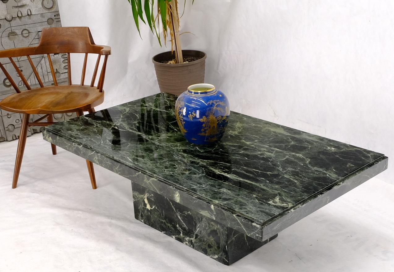 Mid century Italian modern dark green almost black with white veins marble top coffee table.