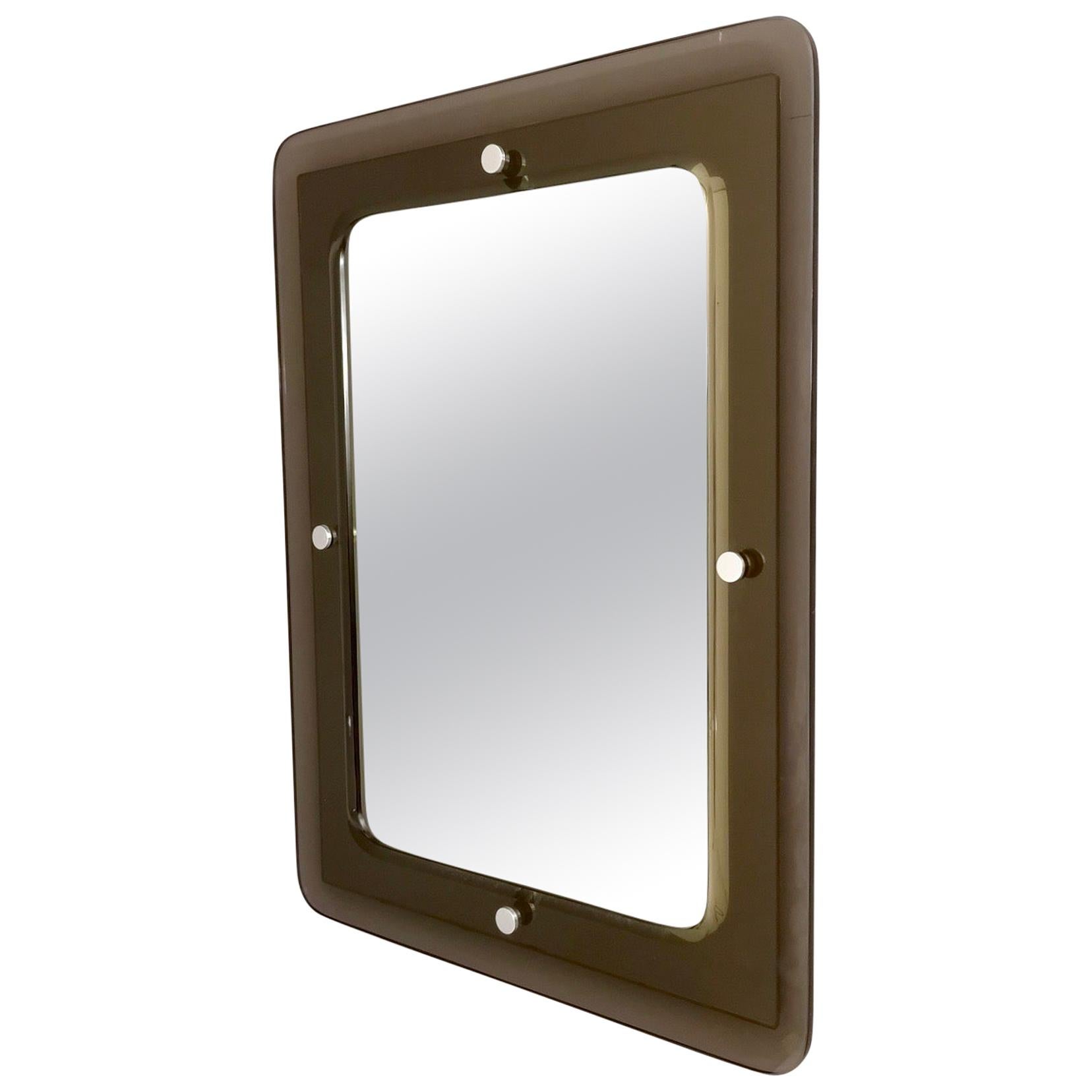 Made in Italy, 1960s.
This mirror features a beveled smoked glass frame with nickel-plated brass details. 
It can be positioned both horizontally and vertically.
It might show slight traces of use since it's vintage, but it can be considered as