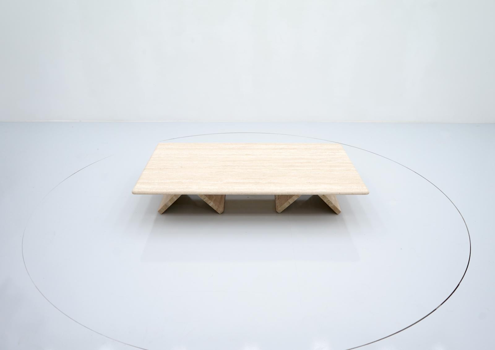 Rectangular coffee table in Italian travertine, 1970s. The table can be placed deep or high. 
Very good condition.

Details:

Creator: unknown
Period: 1970s
Color: beige
Style: Mid-Century Modern
Place of Origin: Italy
Dimensions: wide