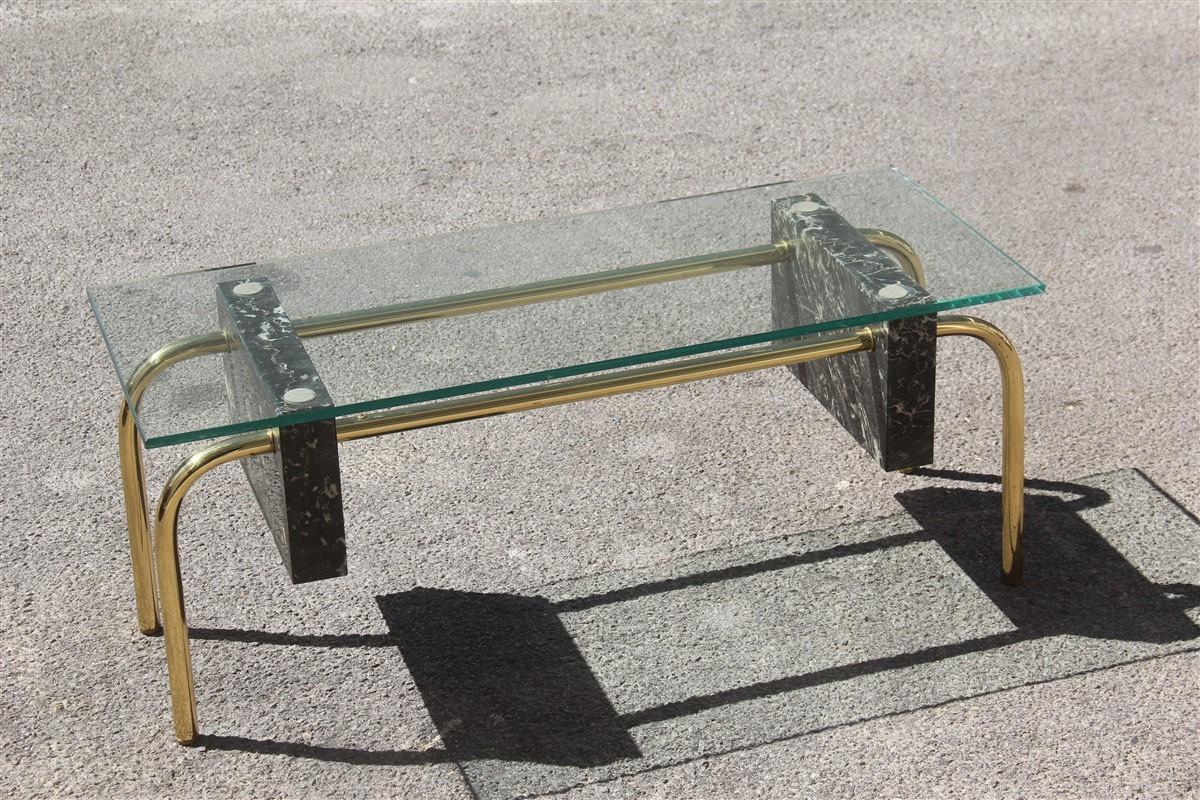 Rectangular table coffee Italian design 1970s brass marble Portoro glass top.
Made of brass tubular, with large blocks of Portoro marble, the upper part a thick glass plate.