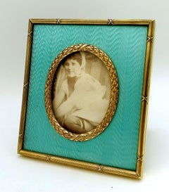 Rectangular table frame for oval photo in sterling silver with fired enamels