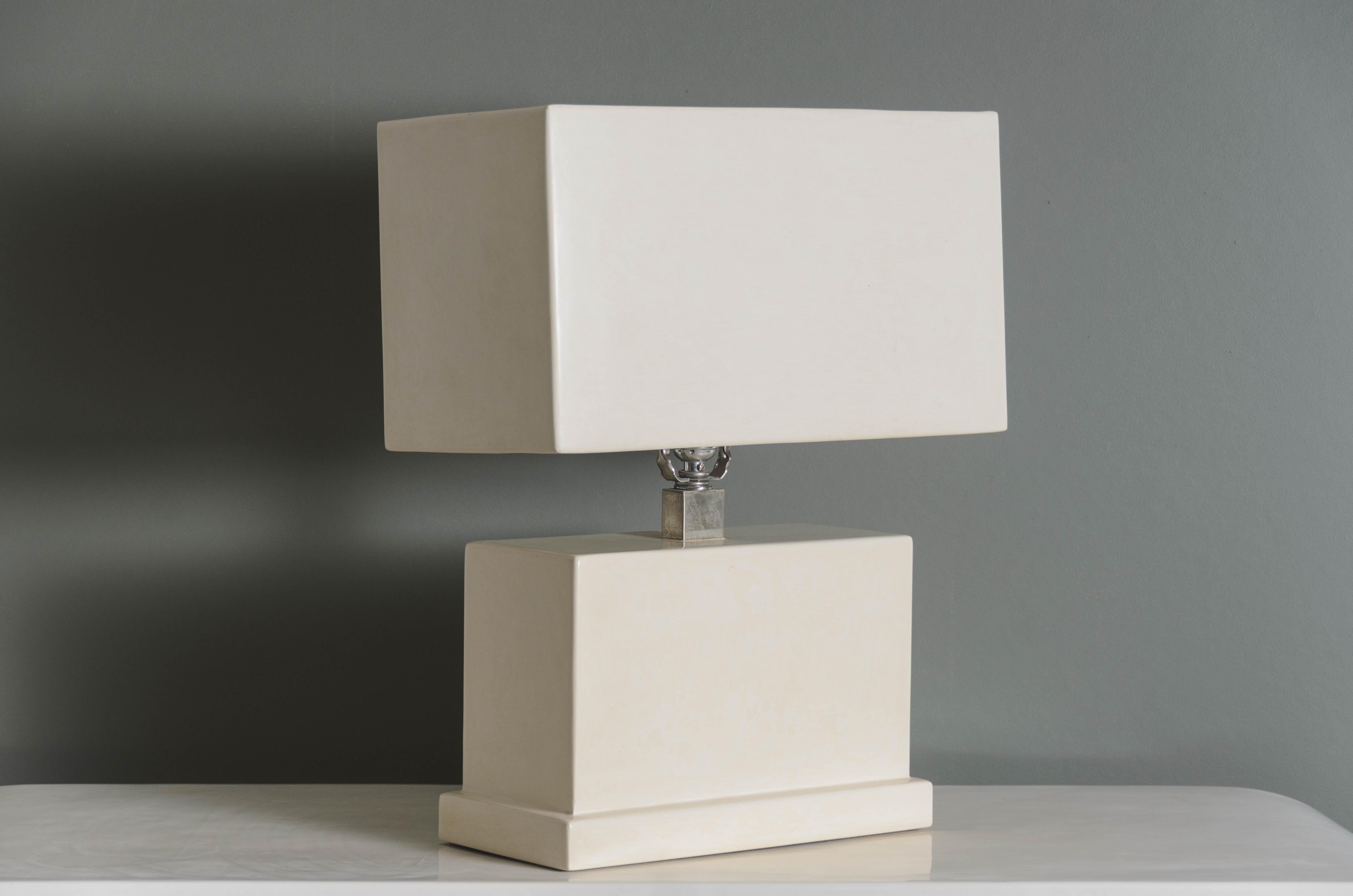 Rectangular table lamp and shade set
Cream Lacquer
Metal Base
Hand Repoussé
Limited Edition
Each piece is individually crafted and is unique. 
Lacquer is a technique that dates back to the Shang dynasty, circa 1600-1100 B.C. These pieces are