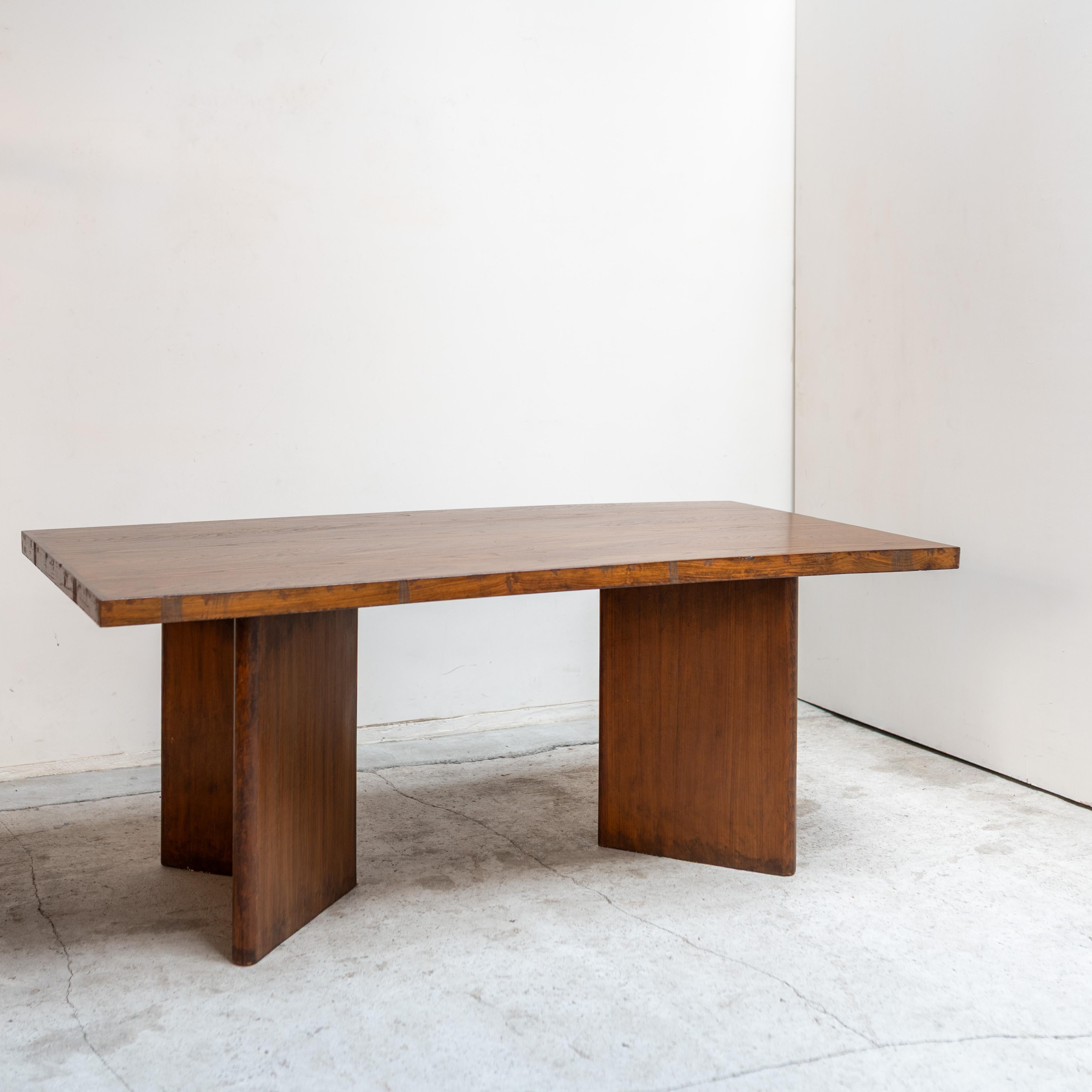 A rare and authentic example from the Chandigarh project in India, this rectangular table by Pierre Jeanneret reflects the architect’s rational yet sculptural design language. Characterized by its solid teak construction, the table rests on two