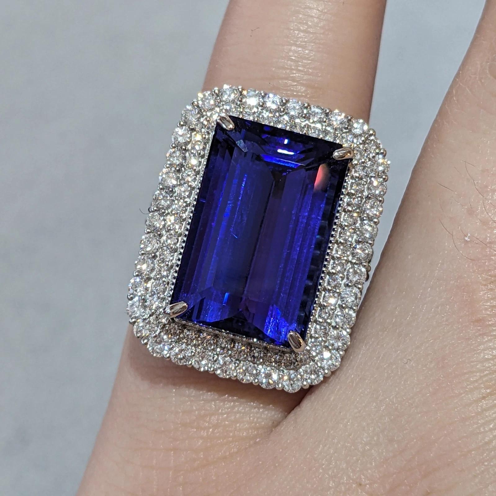 Rectangular Tanzanite 21.19 ct and Diamond Ring in Platinum 

Tanzanite and Diamond Ring features a very clean Rectangular Emerald cut Tanzanite weighing 21.19 carats surrounded by two rows of Round Brilliant Diamonds and 3 Rows of Diamonds going