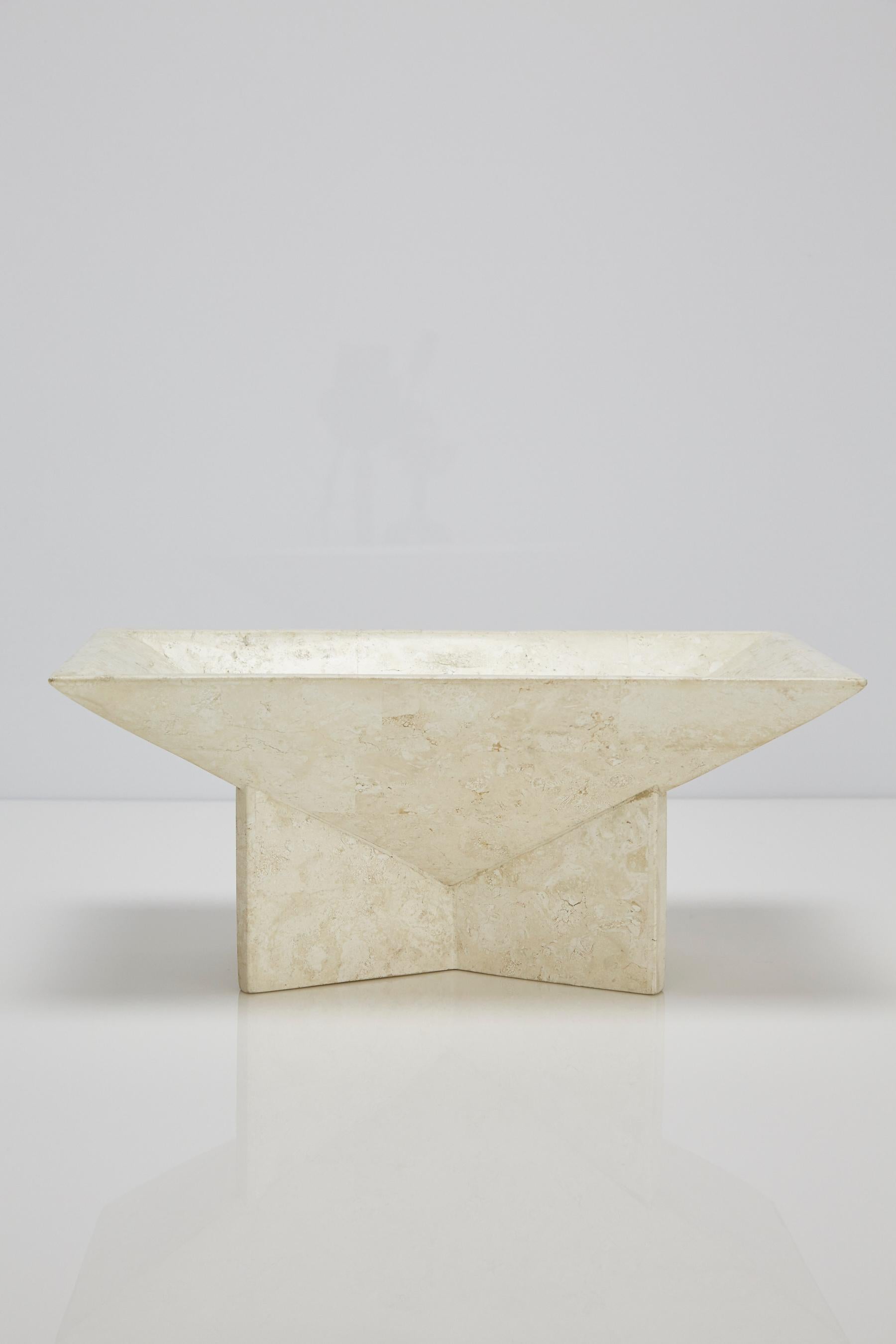 Modernist rectangular bowl on an elevated base. Entire piece covered in ivory white tessellated stone.

All furnishings are made from 100% natural Fossil Stone or Seashell inlay, carefully hand cut and crafted piece-by-piece and precisely inlaid to