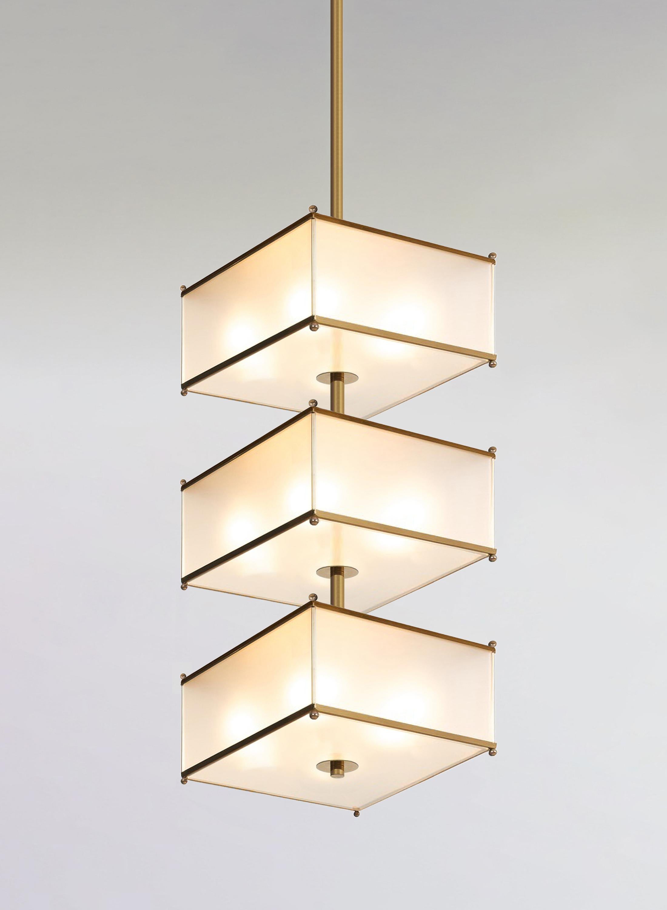 Rectangular three-tier chandelier made of polished brass and opal glass, customizable. Production time c. 12 weeks.