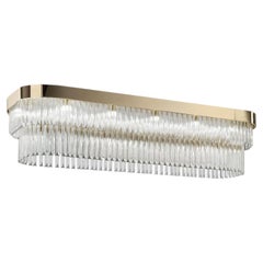 Lámpara de araña rectangular de cristal transparente con acabado dorado y estructura metálica, de 22 luces