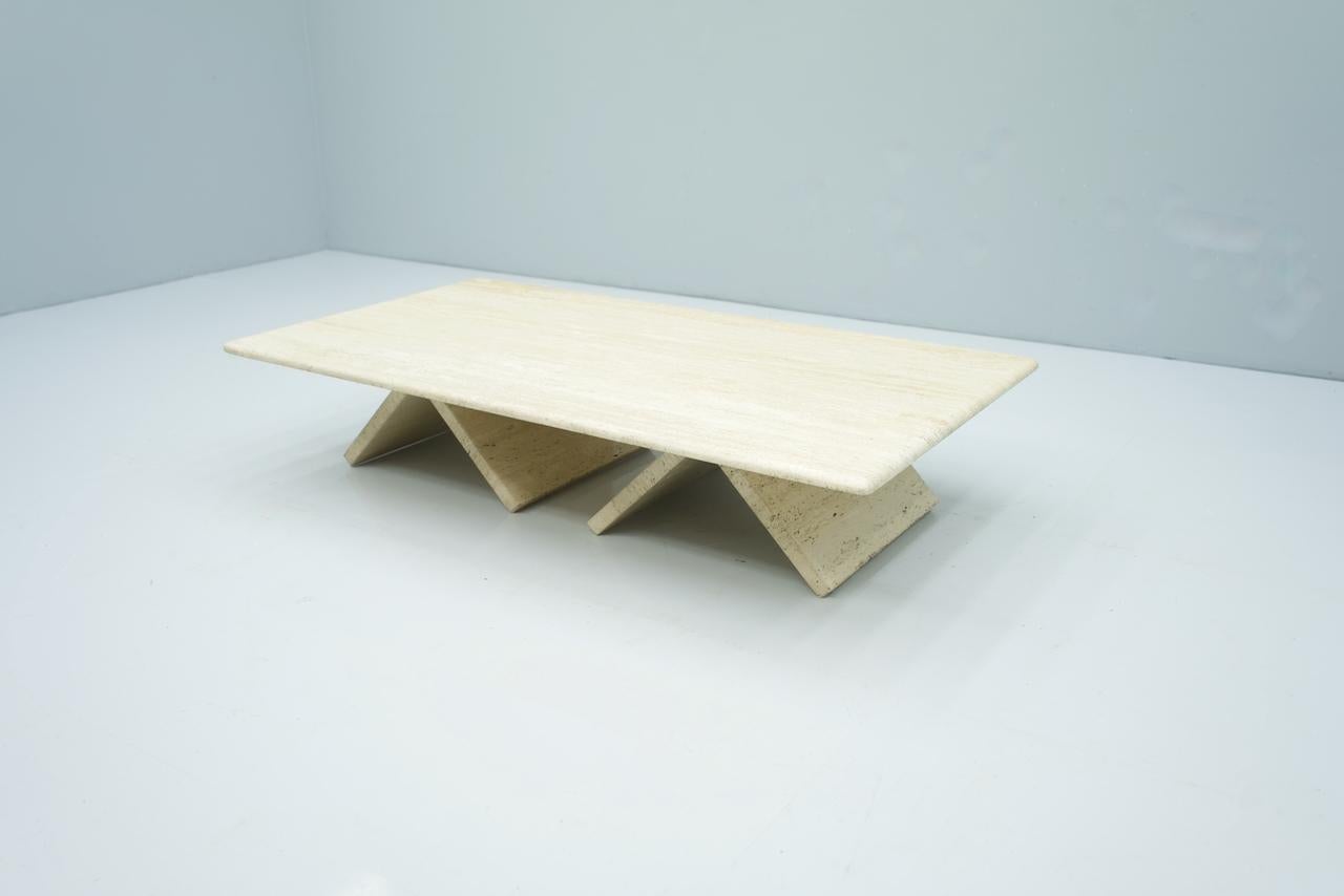 
Rectangular Traverin Coffee Table from the 70s made of Italian travertine. Very nice color, open-pored. The table can be constructed differently by the triangular legs.
W 131.5 cm, D 72 cm, H 26 cm.


Very good condition.