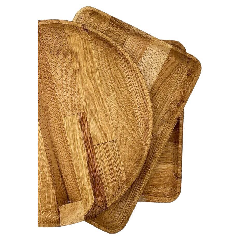 These Wooden Trays are a beautiful addition to any home. Made with high-quality wood and expert carpentry, they're both durable and visually appealing. You can purchase a set or pick the shape you prefer. Plus, they're easy to clean with water and