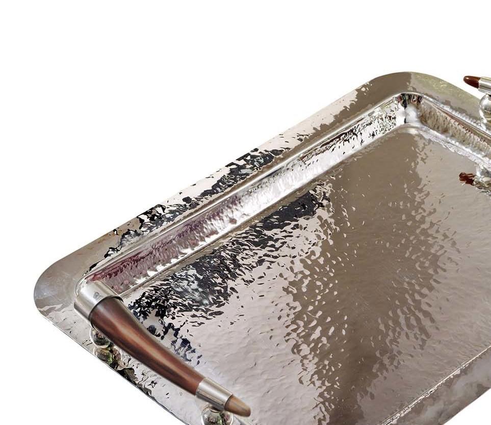 This sophisticated tray of the exclusive Horn collection by Petri Firenze is entirely handcrafted of silver plated brass. Showcased on a coffee table, bedroom dresser or bar cabinet, this tray is a refined choice for serving drinks or displaying