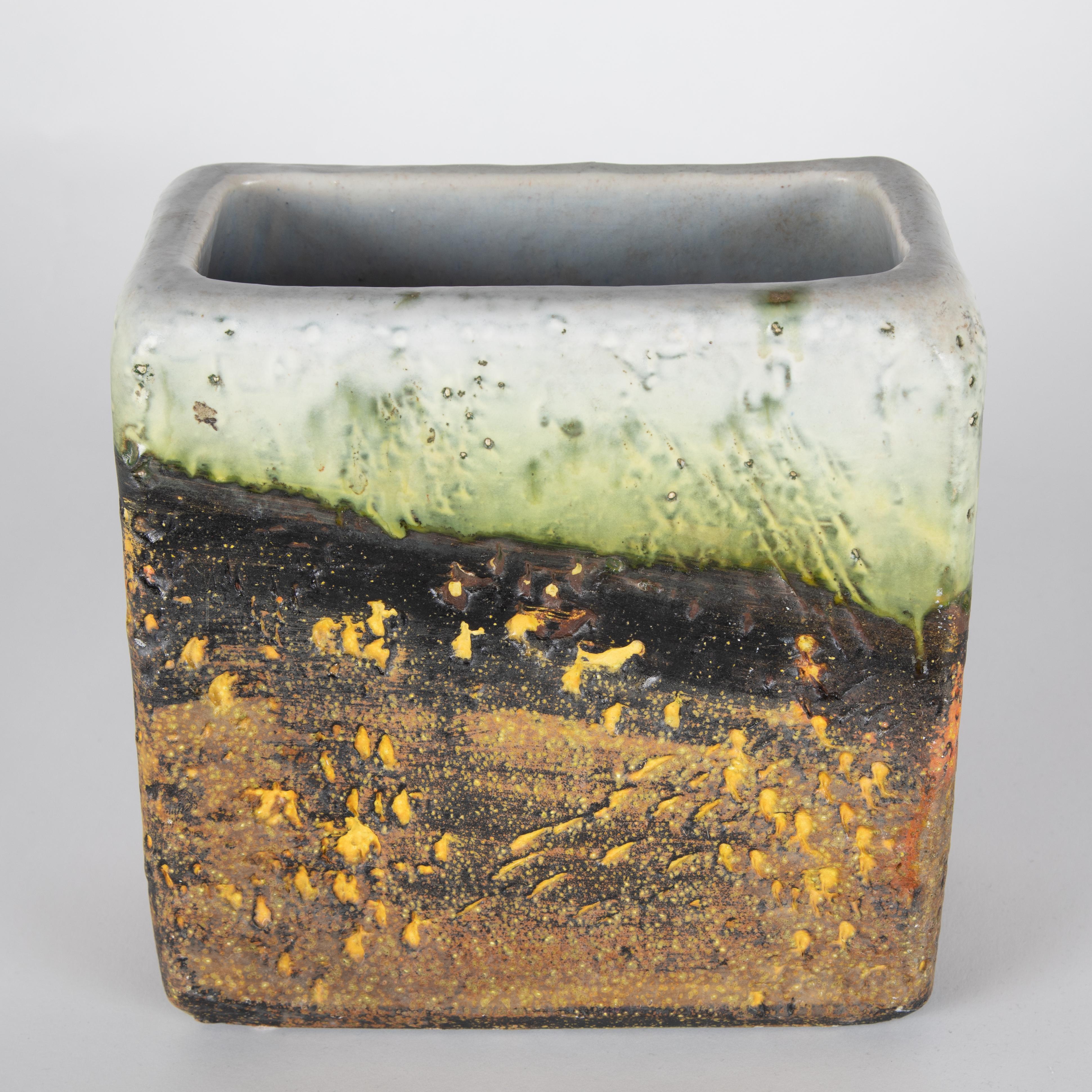 Large rectangular, hand-formed vase by Italian master ceramicist Marcello Fantoni. The lower portion of the vase has various shades of rough brown glaze with orange and yellow accents. The upper portion features milky-white and lime-green glazes on