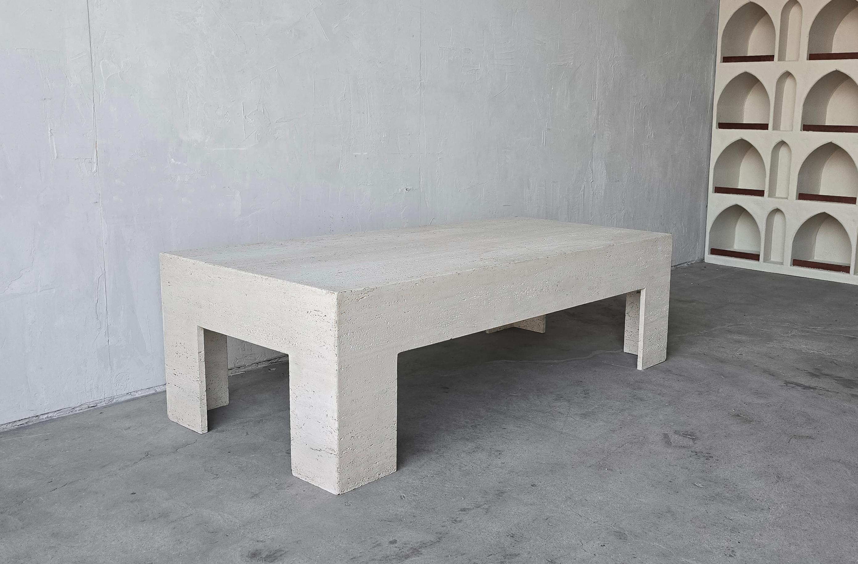 Make a huge statement with this monumental, unfilled travertine coffee table. Table is very modern, with thick proportions. This table is the perfect piece if you need durability, size and style. 

Table is in excellent condition, it has natural