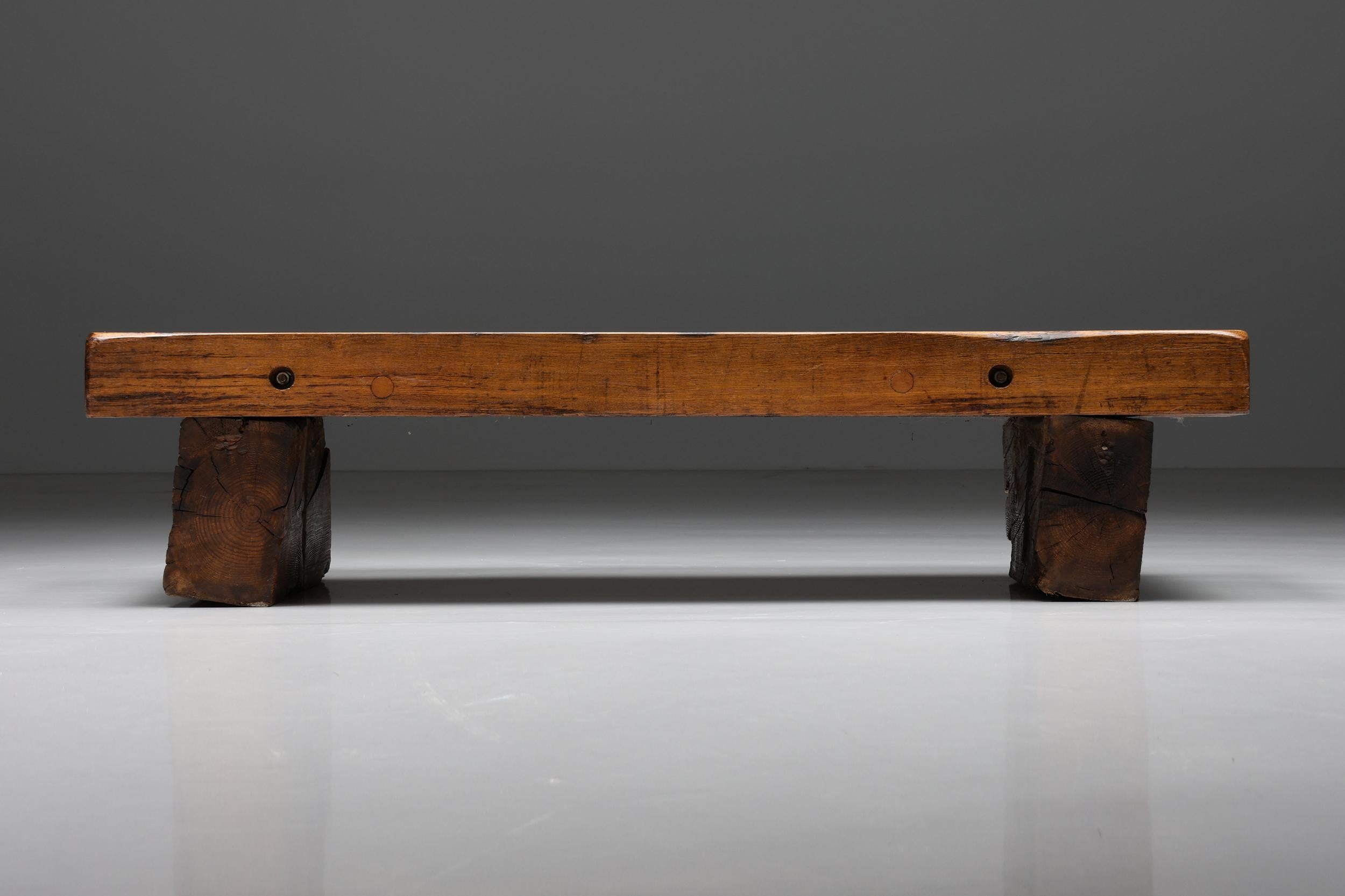 Wabi-Sabi two-legged wooden coffee table with screws, Mid-Century Modern, 1940s 

Mid-century two-legged wooden coffee table with screws. The tabletop consists of three pieces of solid wood, on the sides you can see the screws that keep the wood