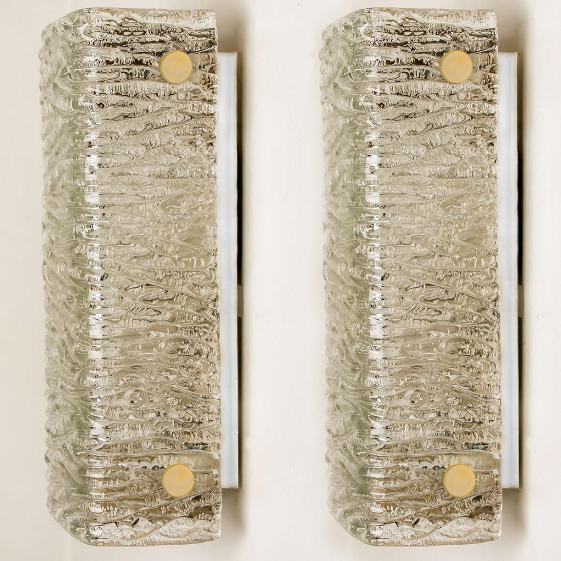 Wave glass rectangular fixtures by J.T. Kalmar, Vienna, Austria, manufactured in circa 1960. The glass shows a beautiful wave texture, which gives a diffuse light effect and a nice pattern on ceiling, walls and floor.
The stylish elegance of this