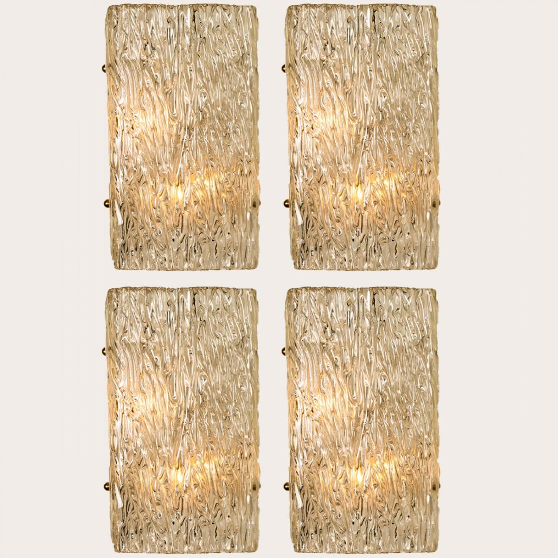 Wave glass rectangular fixtures by J.T. Kalmar, Vienna, Austria, manufactured in circa 1960. The glass shows a beautiful wave texture, which gives a diffuse light effect and a nice pattern on ceiling, walls and floor.
The stylish elegance of this
