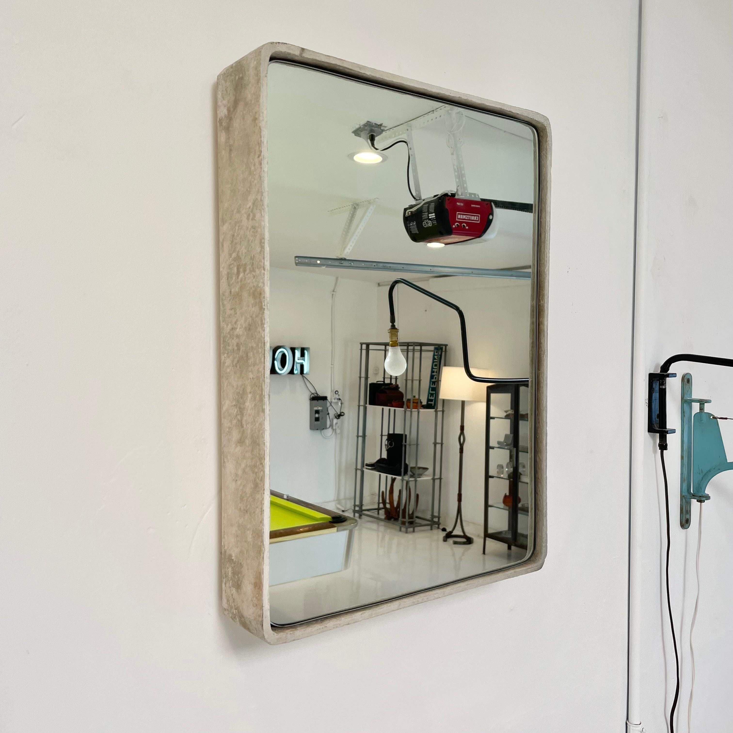 Gorgeous rectangular Willy Guhl concrete mirror. Concrete vessel originally produced at the Eternit factory in Switzerland in the 1960’s and mirror was professionally hand cut and added recently. Beautiful patina as expected with age featuring