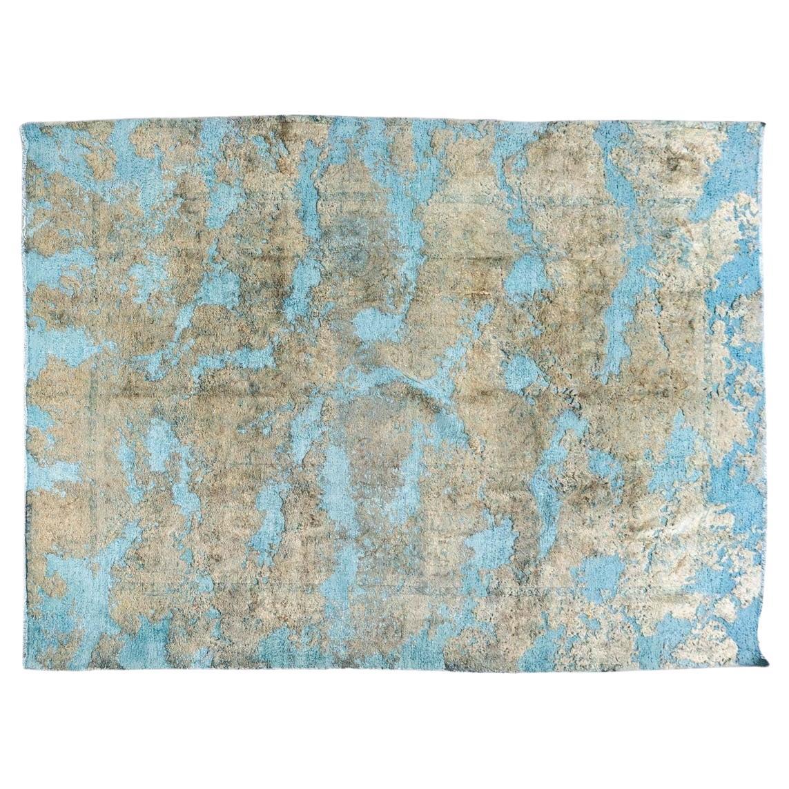 Rectangular wool rug with a light blue background. Contemporary. For Sale