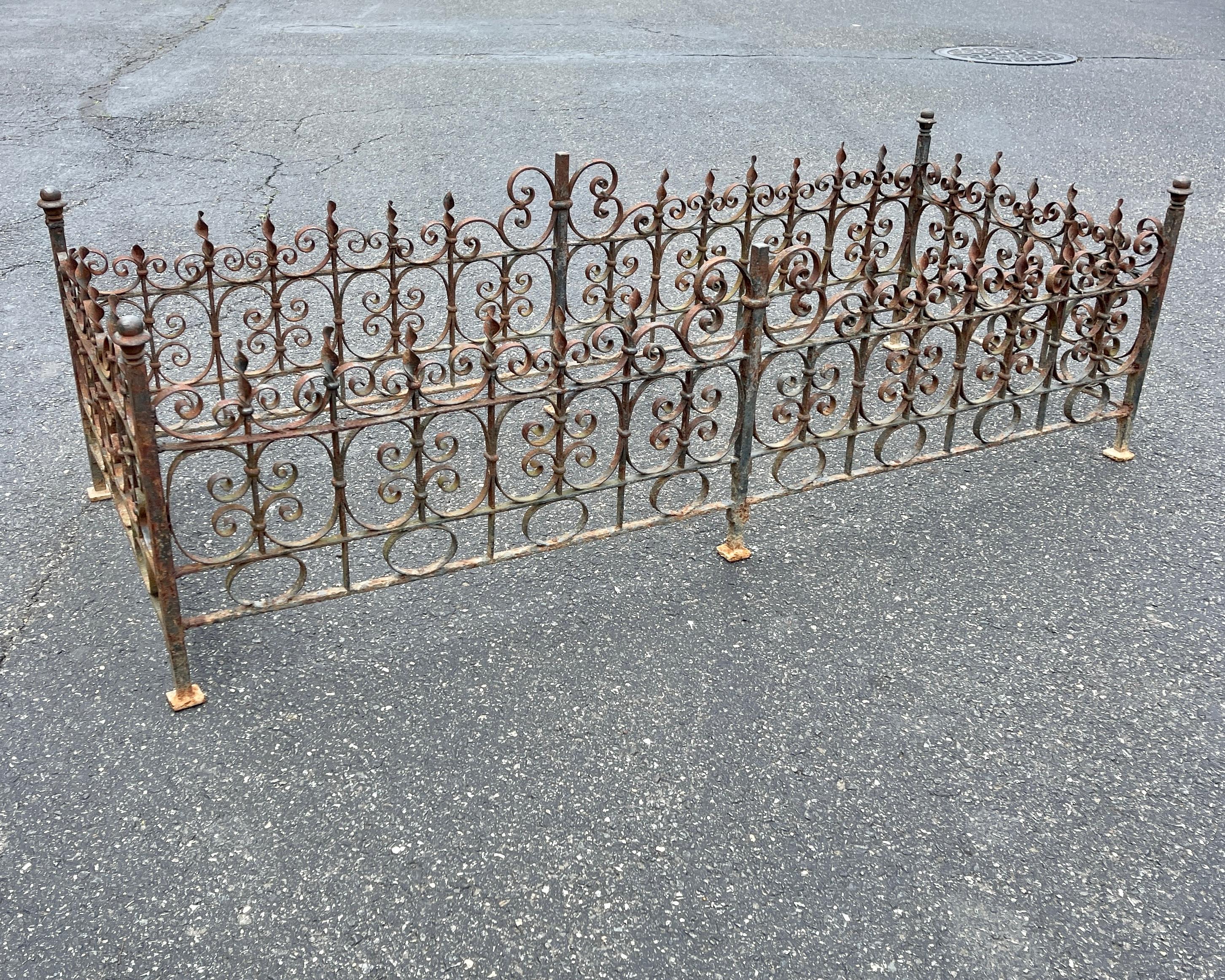 Rectangular wrought iron Architectural Element
This vintage wrought iron fence element is the perfect patio cocktail table base and has an amazing unbeatable patina.

A 1/2 inch tempered rectangular glass top, measuring 68 by 29 inches can be