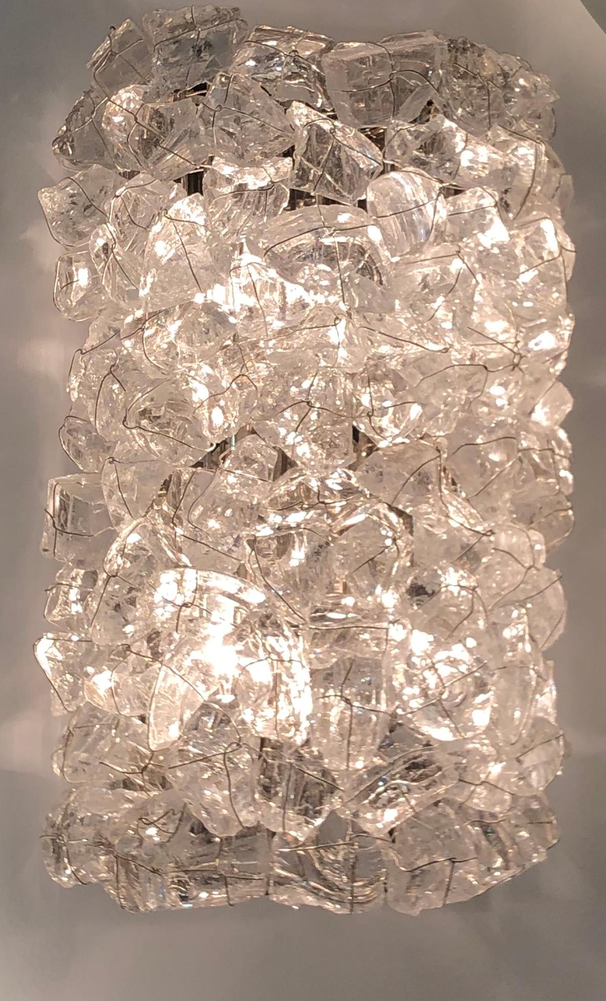 Glass: Recycled glass crystal
Metal Finishes: Nickel-plated brass, nickel-plated jeweler's wire
Weight: 22 lbs (10 kgs)
Note: Due to the natural character of the glass crystals, the dimensions and weight are approximate.
  