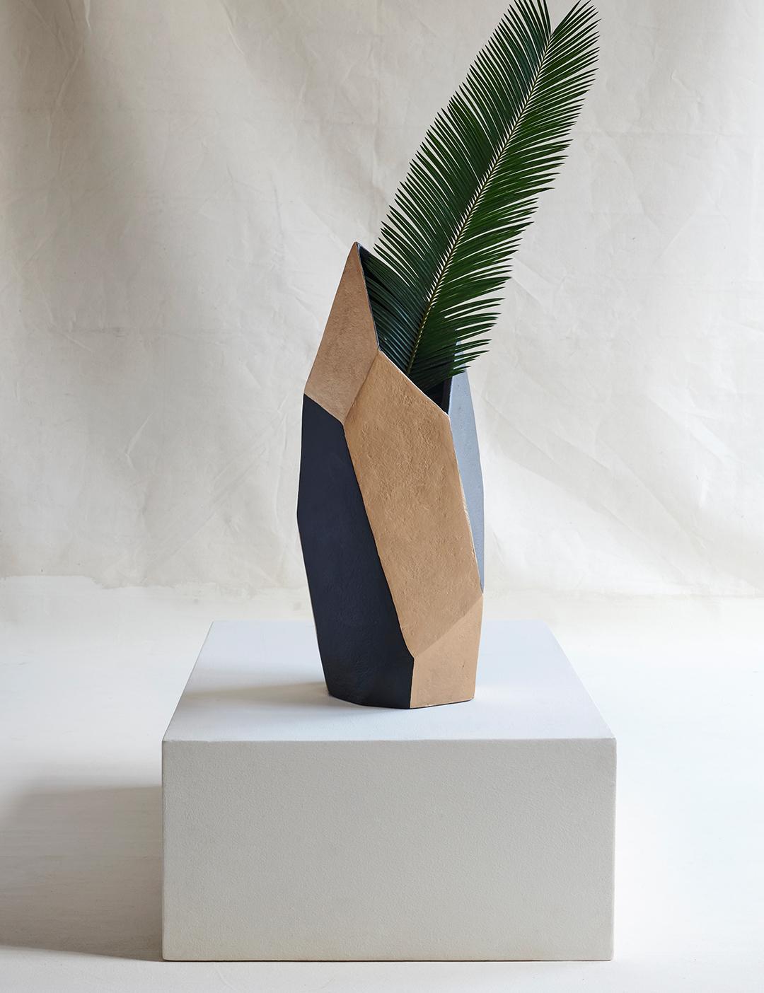 A medium-sized, multi-faceted and angular geometric vessel that is as lightweight and durable as it is visually dynamic.

For indoor or outdoor use, in covered environments.

Dimensions (in): 5.2