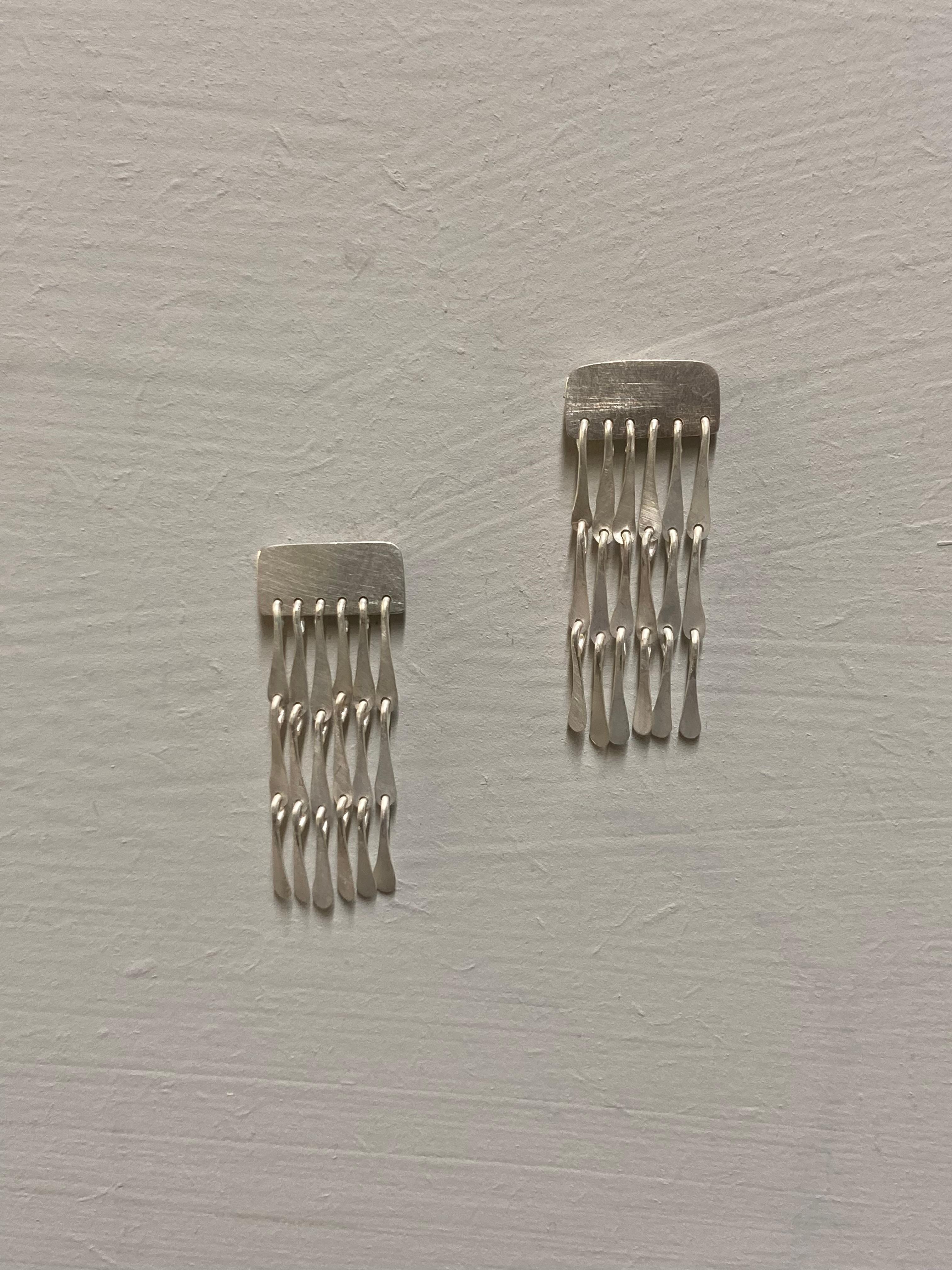 These lightweight earrings are a perfect everyday statement. Flowy delicate strands hang from these stud earrings, that are finished with a matte sheen to catch the light when worn. 

All items purchased on this shop are made to order especially for