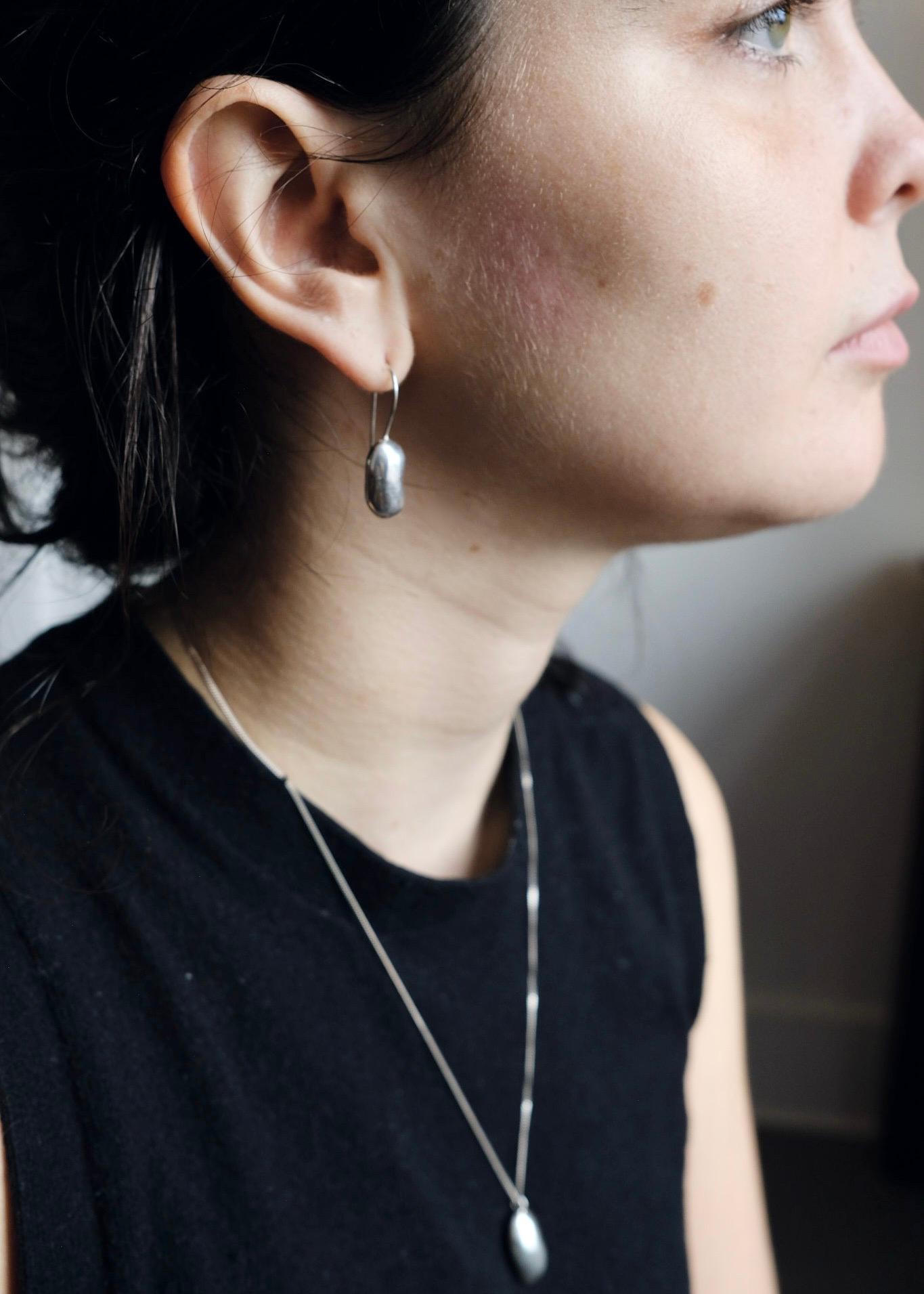 These earrings are elegantly shaped with a playful twist. They are perfect chunky everyday drop earrings.

They are cast from real kidney beans in recycled sterling silver, and are finished with a matte sheen to catch the light when worn. No two are