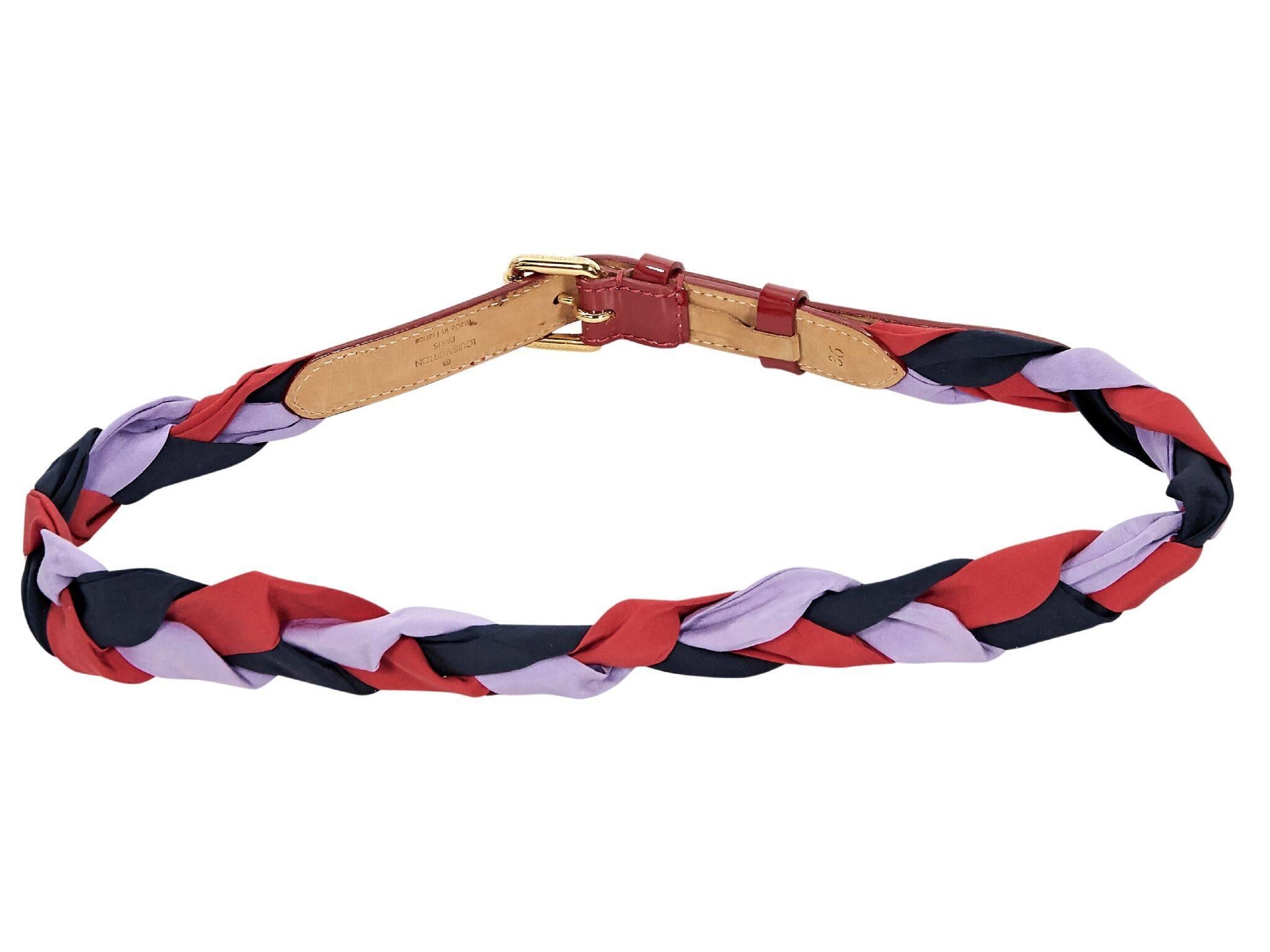 Product details:  Red and purple braided belt by Louis Vuitton.  Trimmed wiht red patent leather.  Adjustable buckle closure.  Goldtone hardware.  Label size FR 36.  33