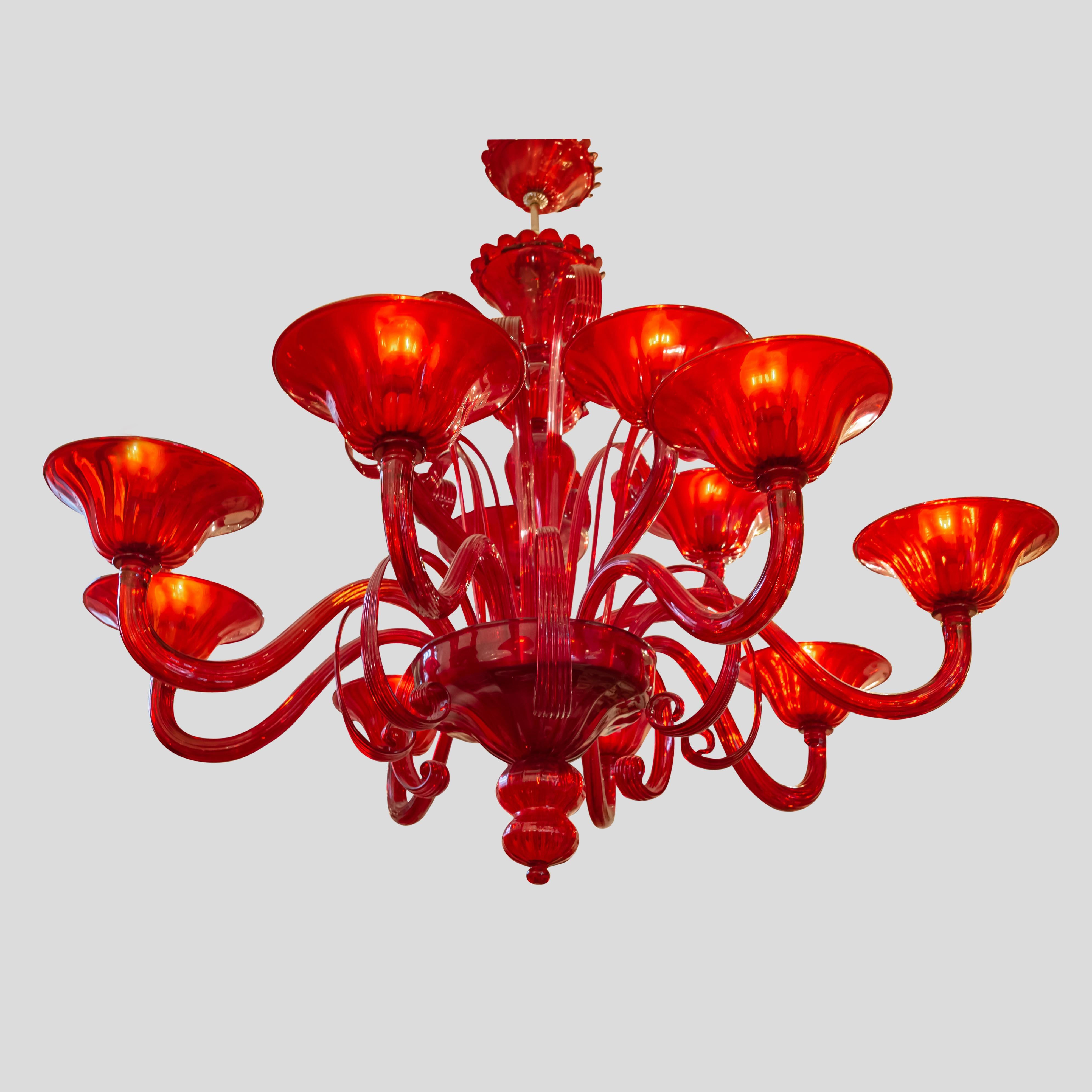 An outstanding “Campari” ruby red colour 12 lighter Classic with a modern touch Venetian chandelier designed by Cenedese and manufactured in their Murano’s furnace
Made in Italy. Signed on the cup belowed
Completely mouth blown each and every