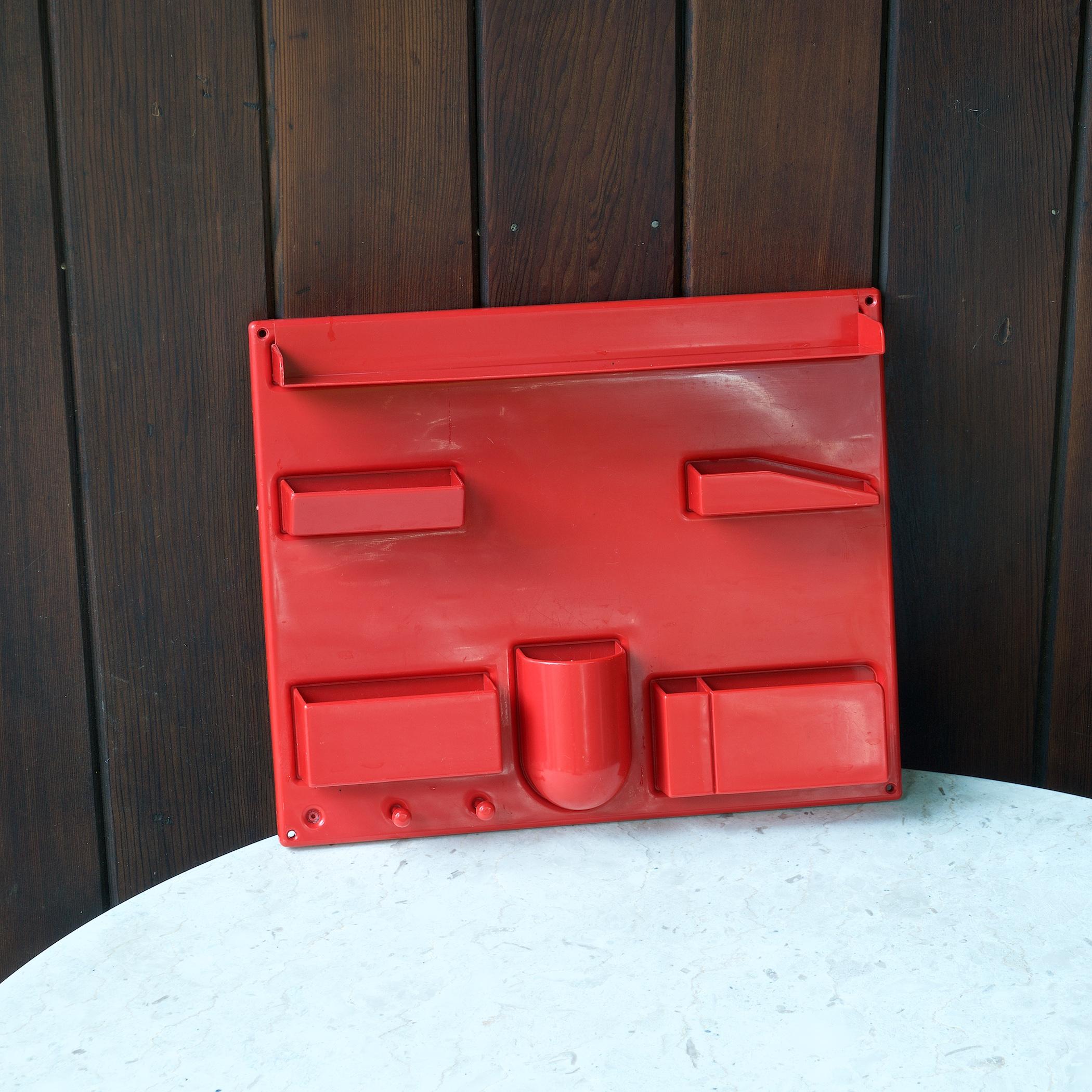 Interesting and well loved seventies pop-art survivor, relic. A wall mounting red plastic catch-all. Very old plastic wall art in your home or studio! Missing one key hook on left.