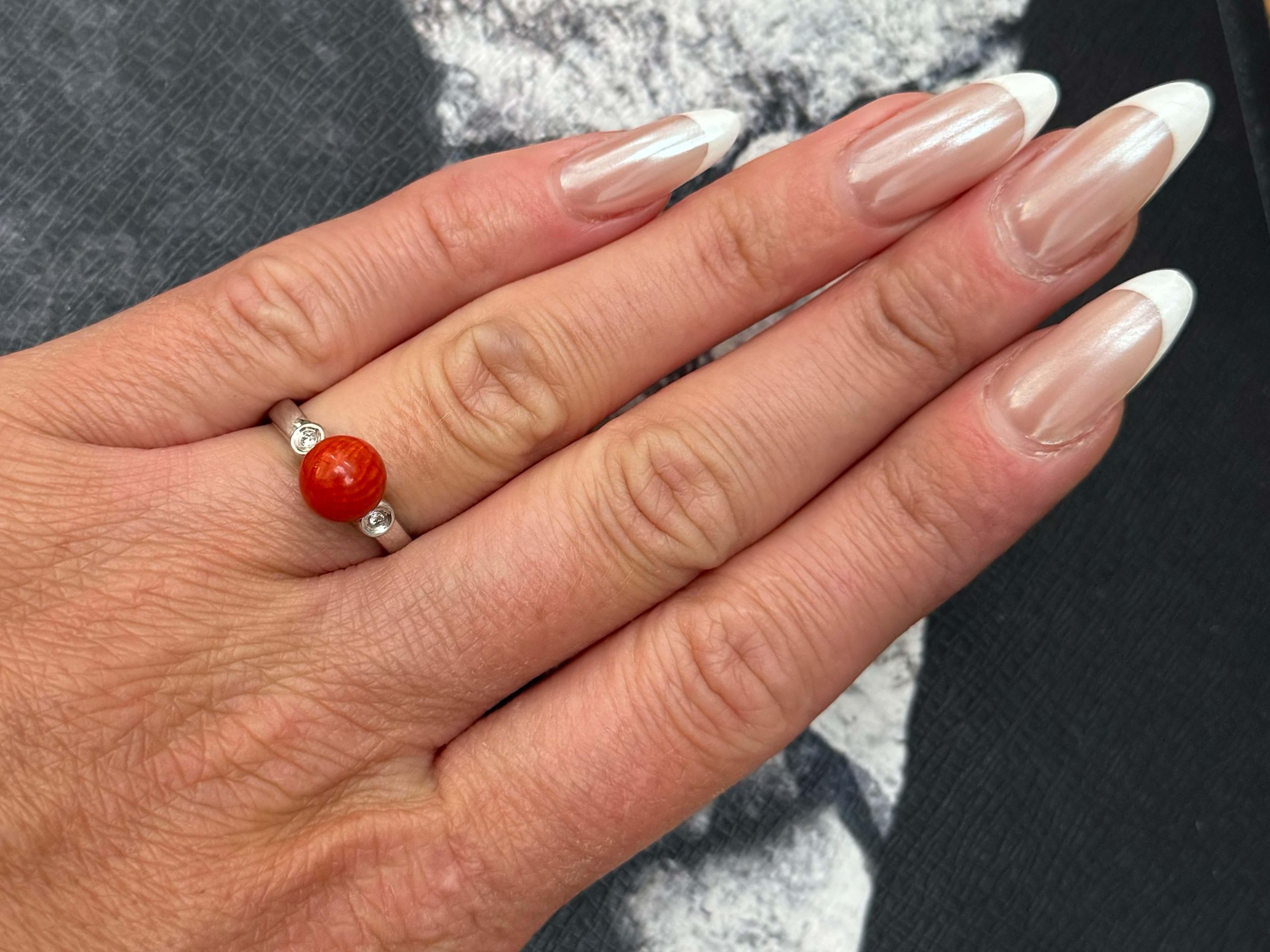 Item Specifications:

Metal: 14K White Gold

Ring Size: 6.5 (resizing available for a fee)

Total Weight: 2.9 Grams

Ring Height: 21 mm

Aka Coral Specifications:

Shape: Sphere

Coral Diameter: 8 mm

Diamond Count: 2 round brilliant cut 

Diamond