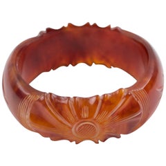 Amber Bakelite Bangle Bracelet with Floral carving