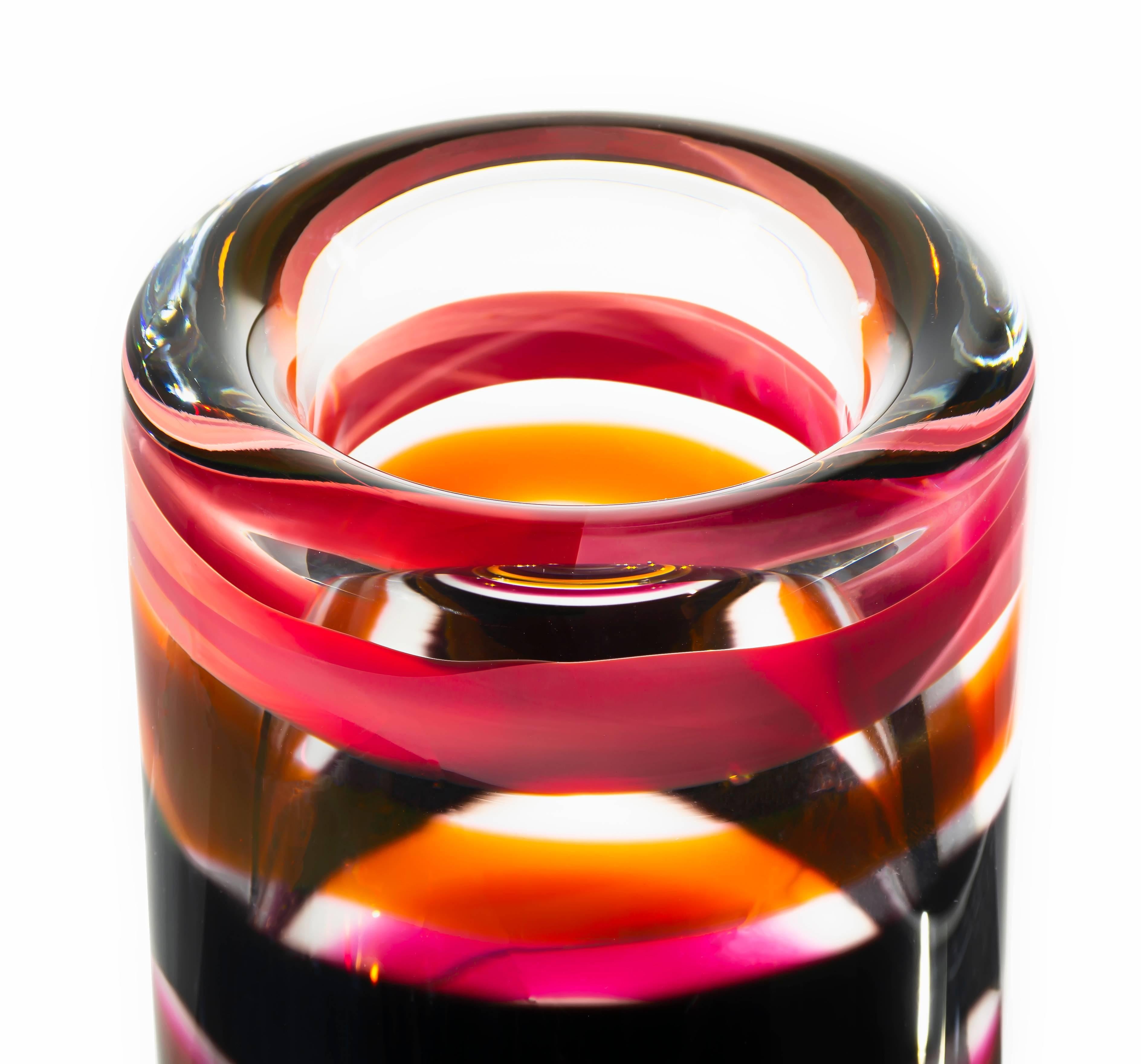 Striped cylinder vase - red amber
Red and amber striped Murano inspired cylinder vase. Glass handblown and shaped in lead free crystal.
Designed by Caleb Siemon, Made in California by Siemon and Salazar.
Handmade.
Striped series.
Lead-free