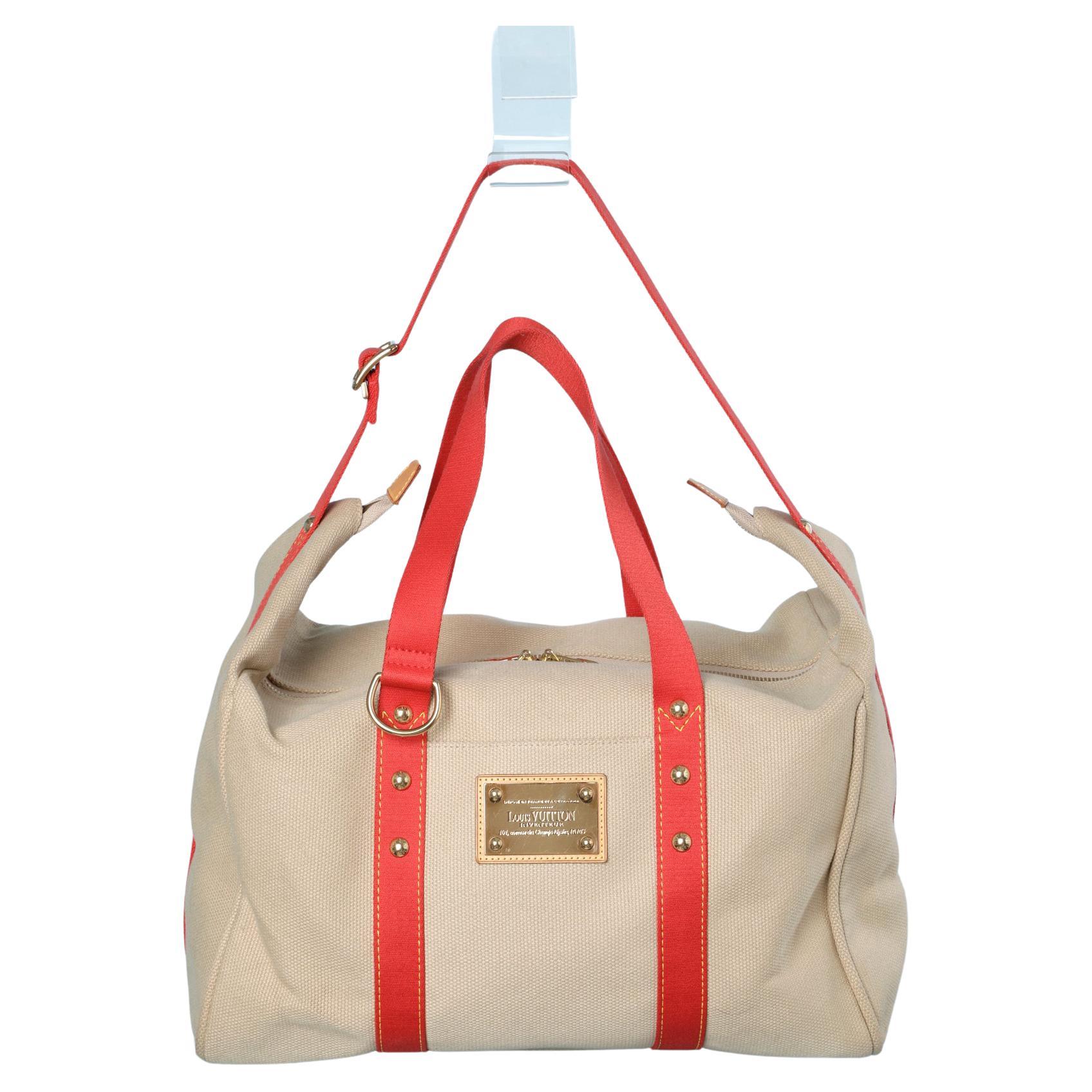 Red and beige canevas week-end bag Louis Vuitton Inventeur For Sale at  1stDibs