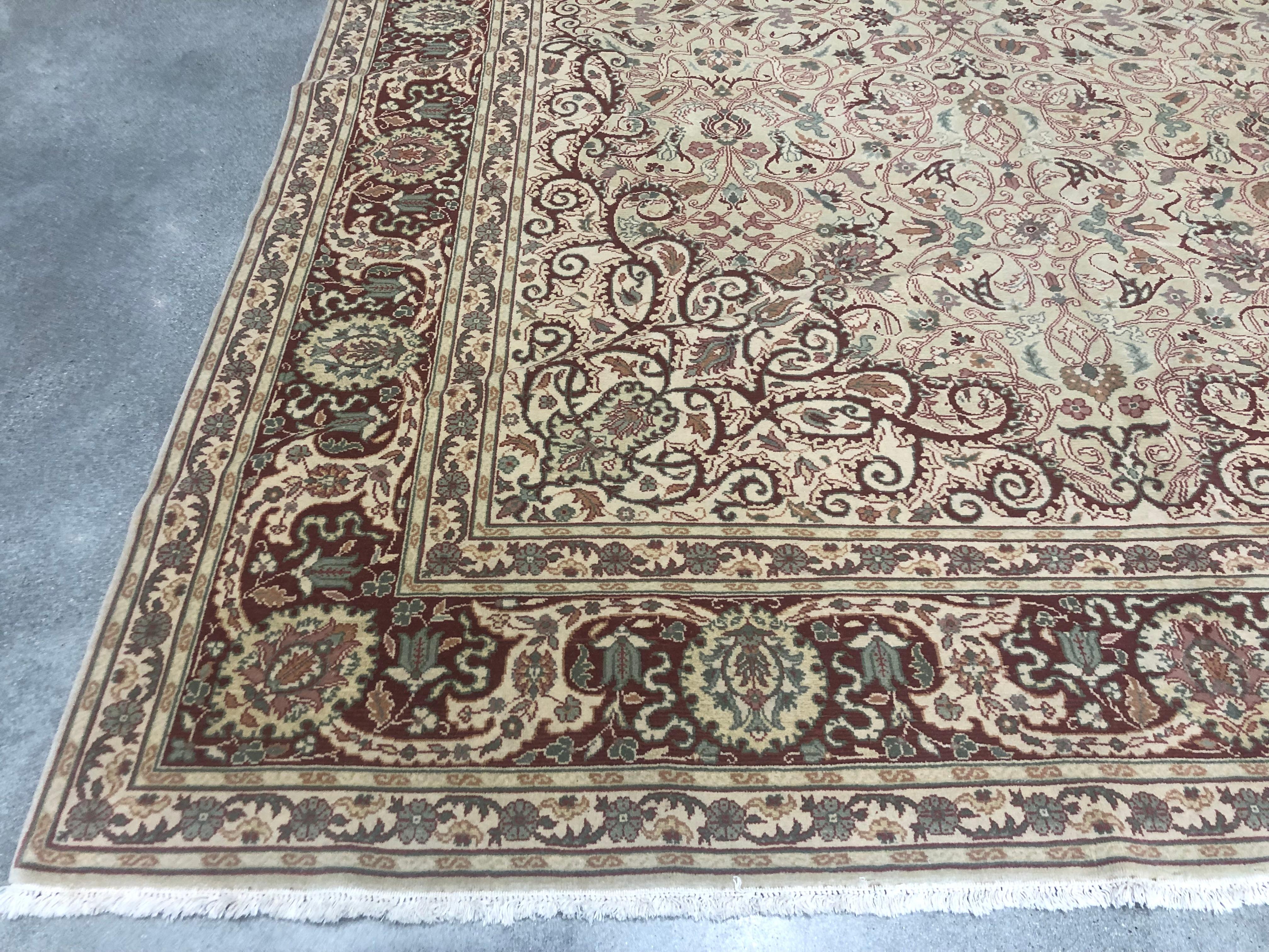 A fine example of a traditional Turkish Sivas style design with a bold red border and beige background. Flowing vines and flowers create a sense of movement and flow that combine grace and elegance. Hand knotted wool.