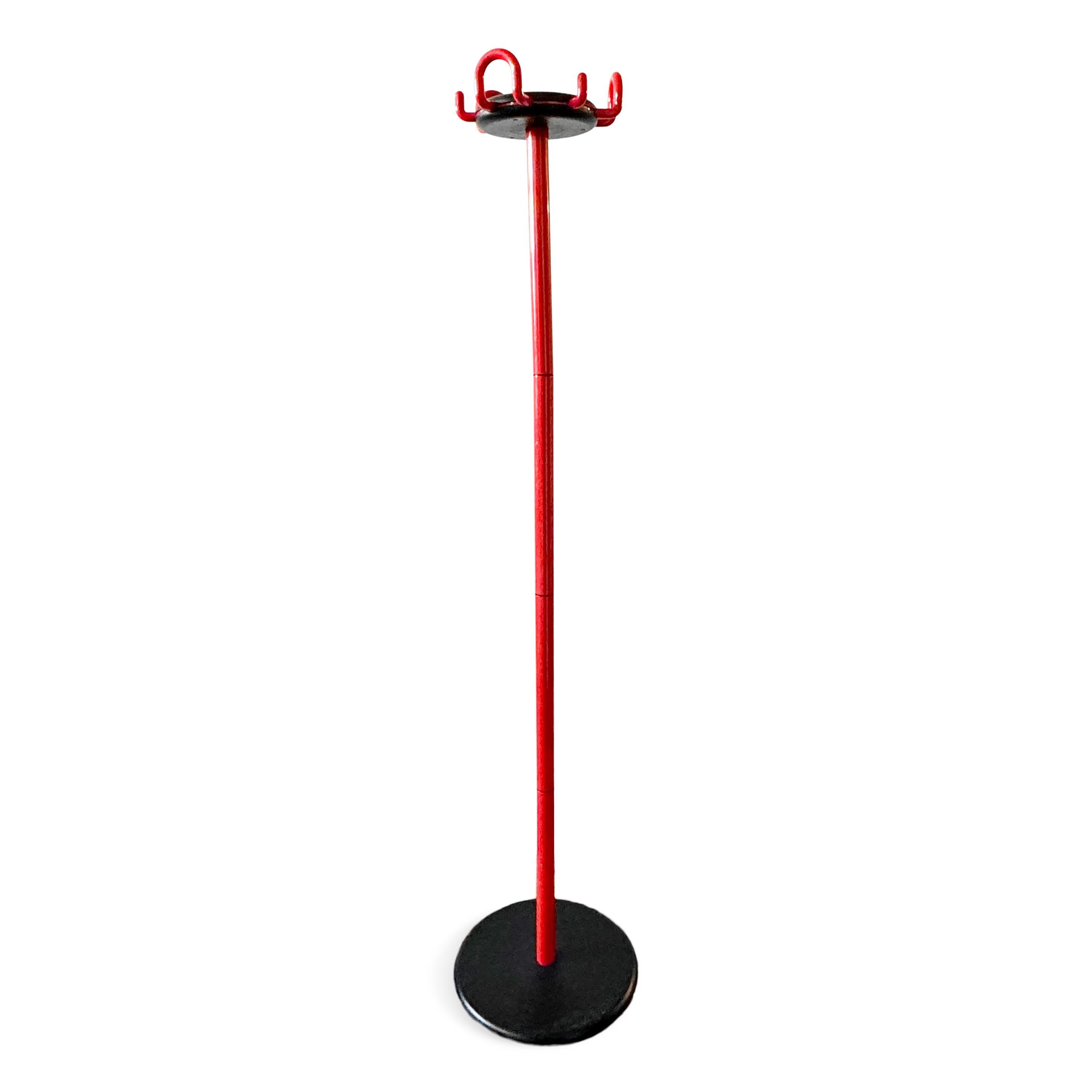 A classic and always fashionable red and black Aiuto coat stand designed by Raul Barberi and Giorgio Marianelli for Rexite in 1982 as the company's first coat rack.  Black steel base, red polymer coated metal stem, with multiple polymer coated metal