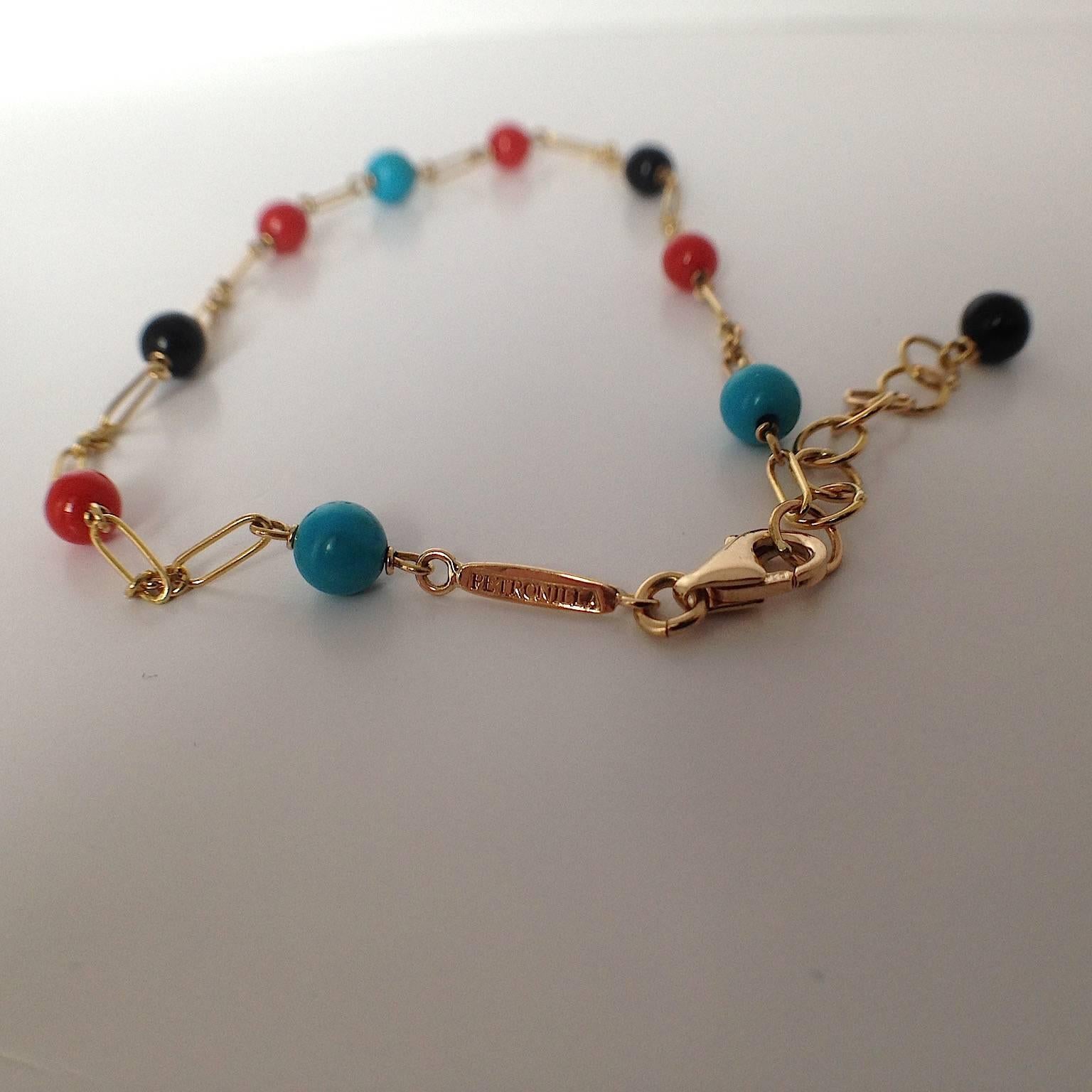 When I think of summer, I think of color and light.
This bracelet is a small sign of summer.
Coral and Turquoise remind me of the beach, the scents and colors of my Italy.

The chain is completely handmade in 18Kt gold and is interspersed with
