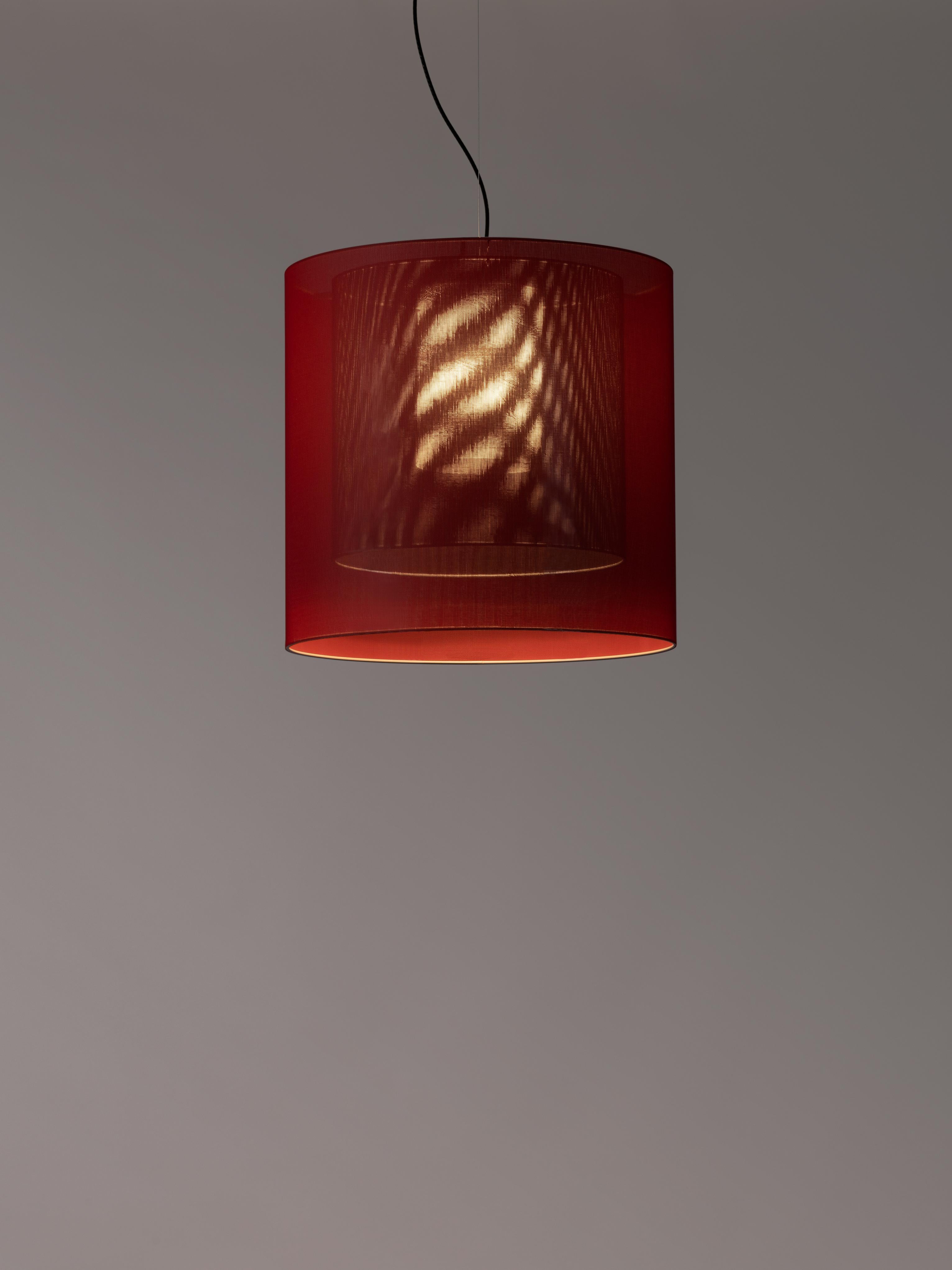 Red and black moaré LM pendant lamp by Antoni Arola
Dimensions: D 62 x H 60 cm
Materials: Metal, polyester.
Available in other colors and sizes.

Moaré’s multiple combinations of formats and colours make it highly versatile. The series takes