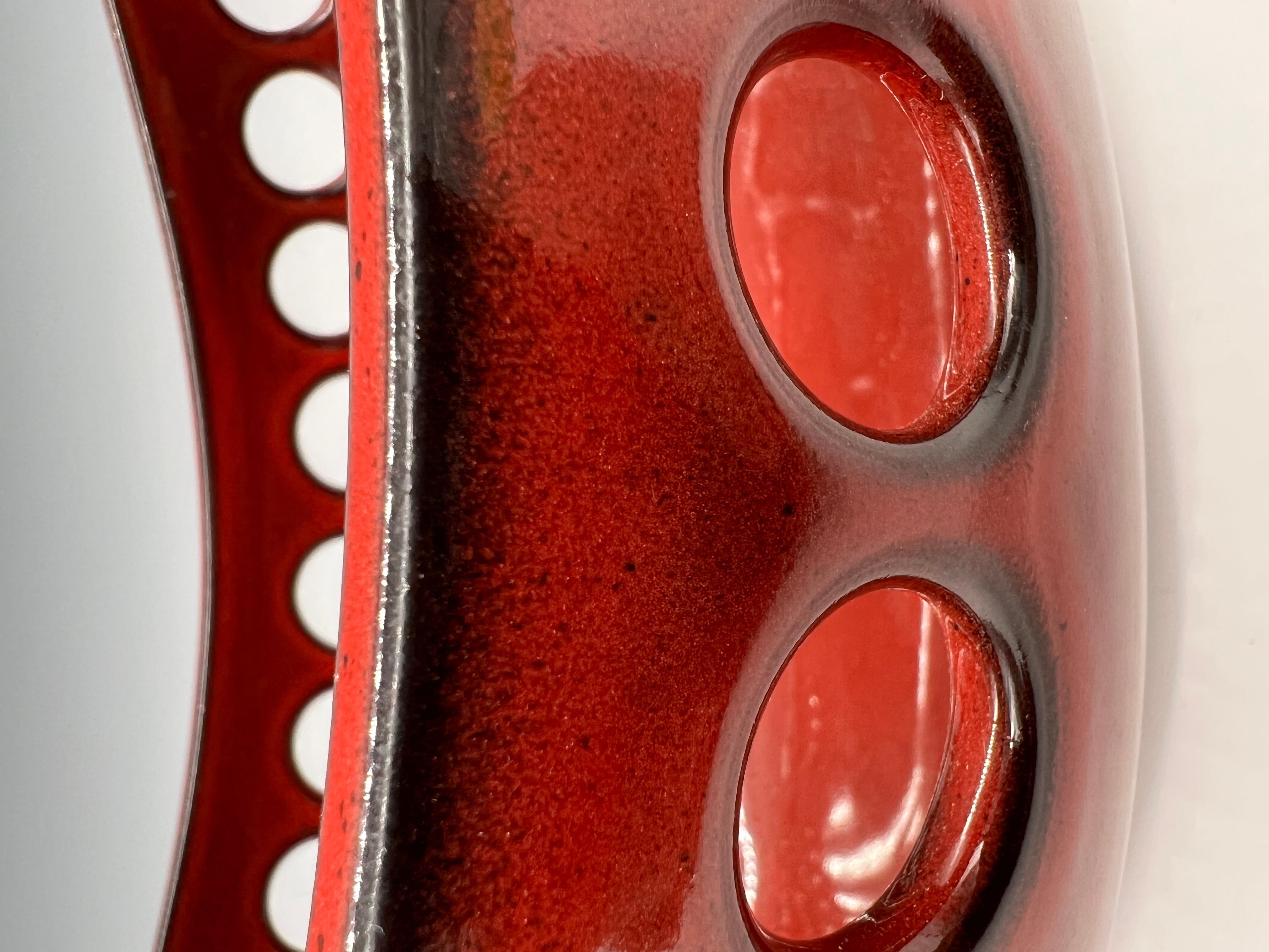 red ceramic fruit bowl