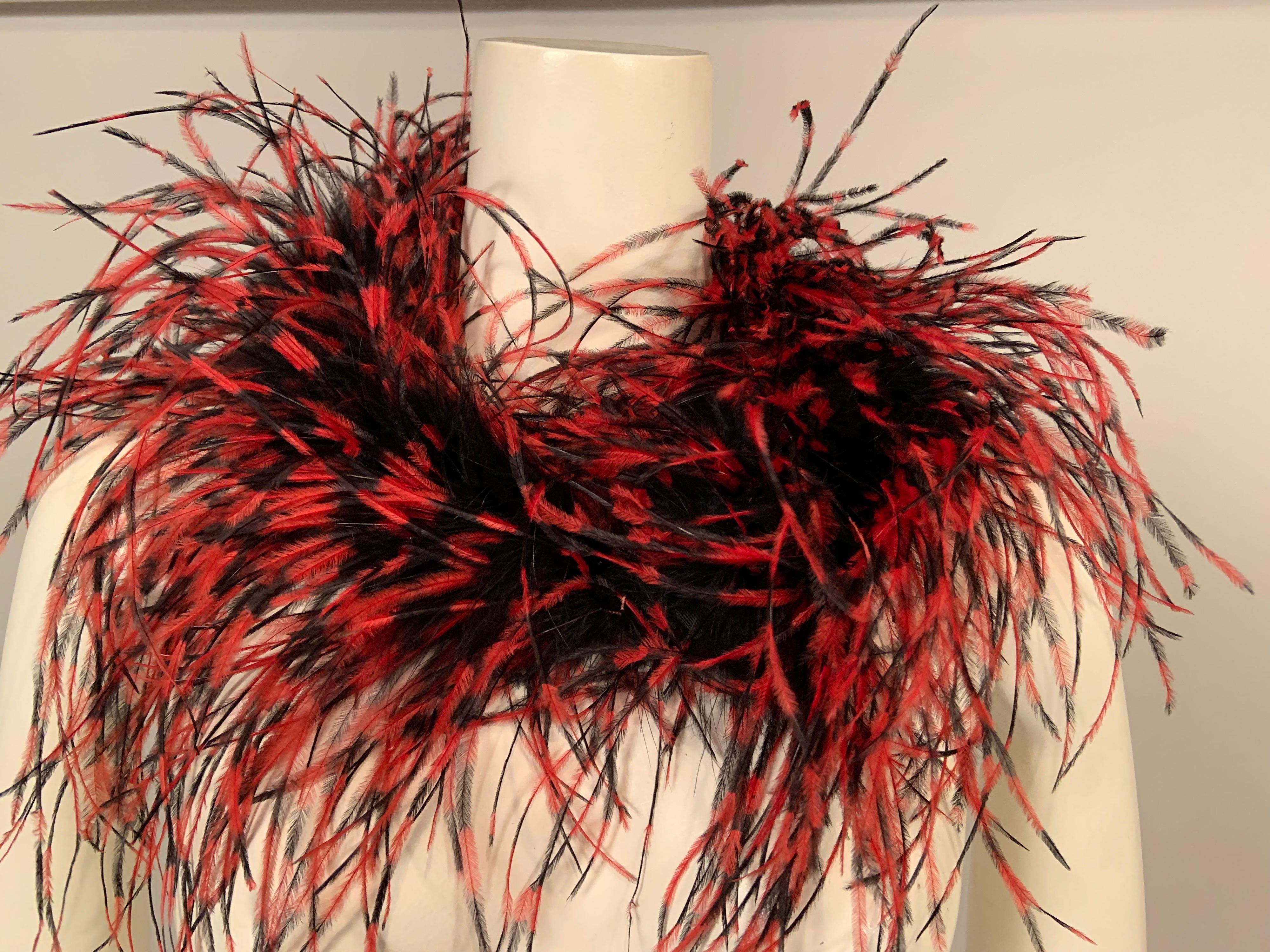 Let this colorful ostrich feather neck piece tickle your fancy this season. The red and black color combination works well with many pieces and it would look great with dresses, strapless gowns, even a coat or jacket. It has a black grosgrain ribbon