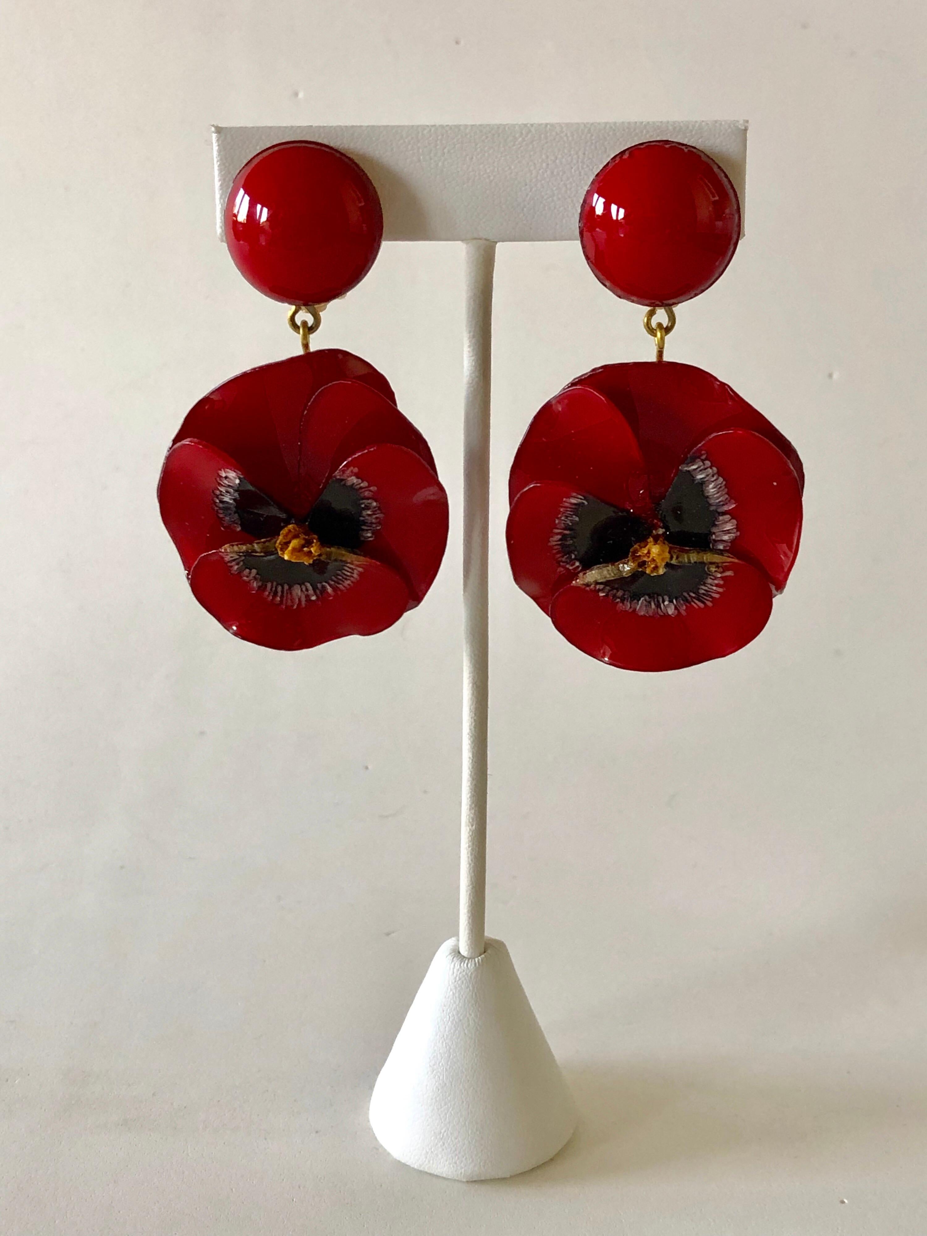 Light and easy to wear, these contemporary handmade fashion forward artisanal clip-on earrings were made in Paris by Cilea. The earrings feature two detailed and whimsical enameline (enamel and resin composite) red pansies. Like all Cilea pieces,