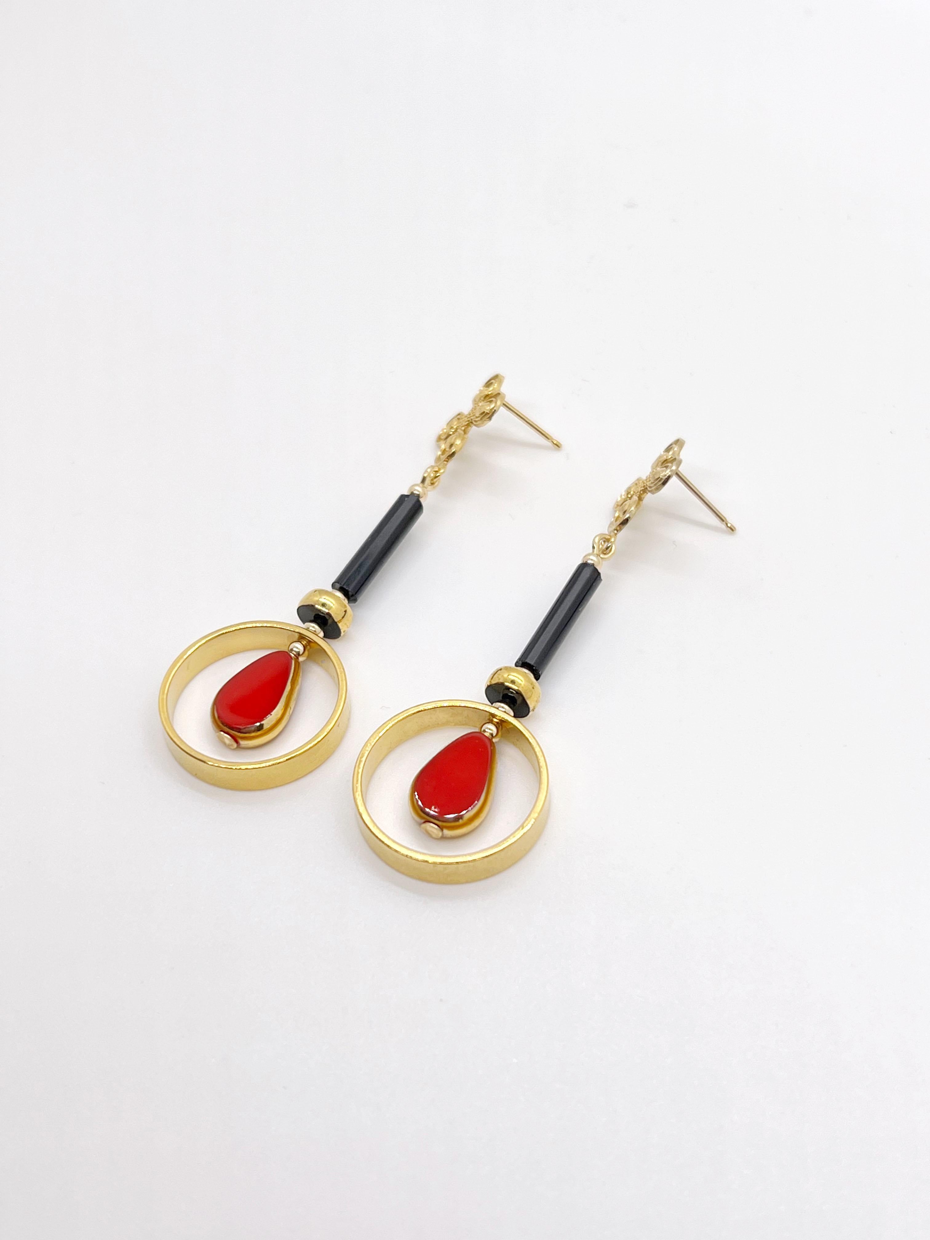 Red Teardrop vintage German glass beads edged with gold, brass metal plated with 24K gold,  black glass bugle bead, gold-filled findings and ear needle. 

The German vintage glass beads are considered rare and collectible, circa 1920s-1960s.

*Our