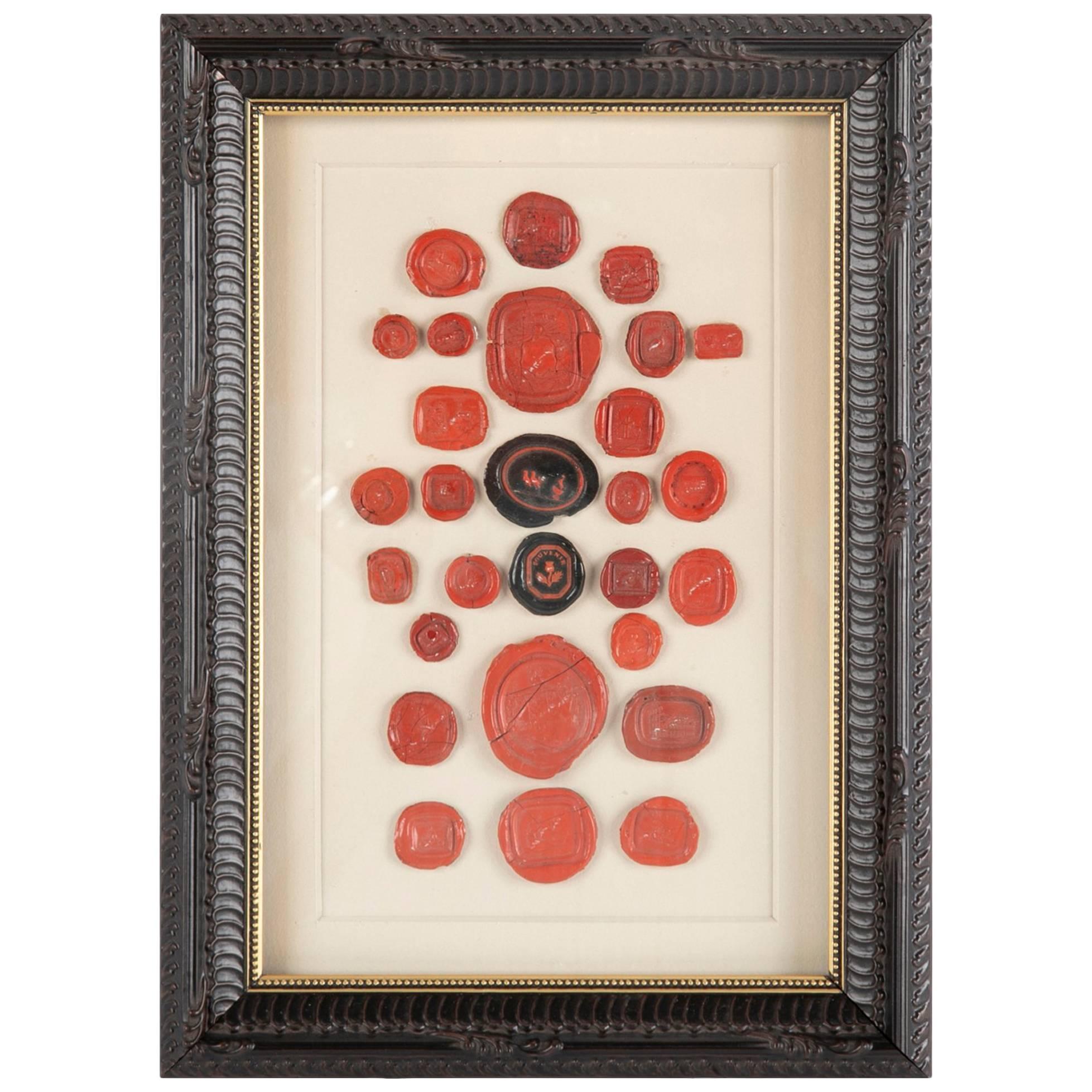 Wonderful collection of four framed groups of 18th-19th century Continental red and wax seals and intaglios from various European countries. Each one of these is a little piece of history, some quite whimsical. My current favorites are the red