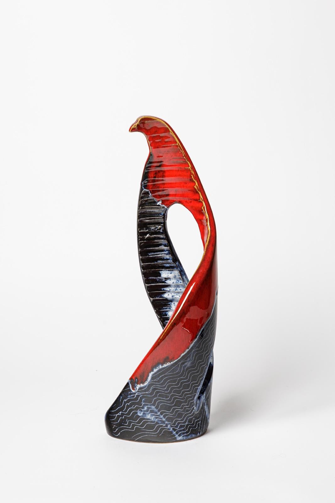 Jean Austruy

Circa 1950

Large abstract ceramic bird sculpture

Blue and red ceramic glazes colors

Original perfect condition

Signed under the base

Measures: height 40 cm
Large 15 cm