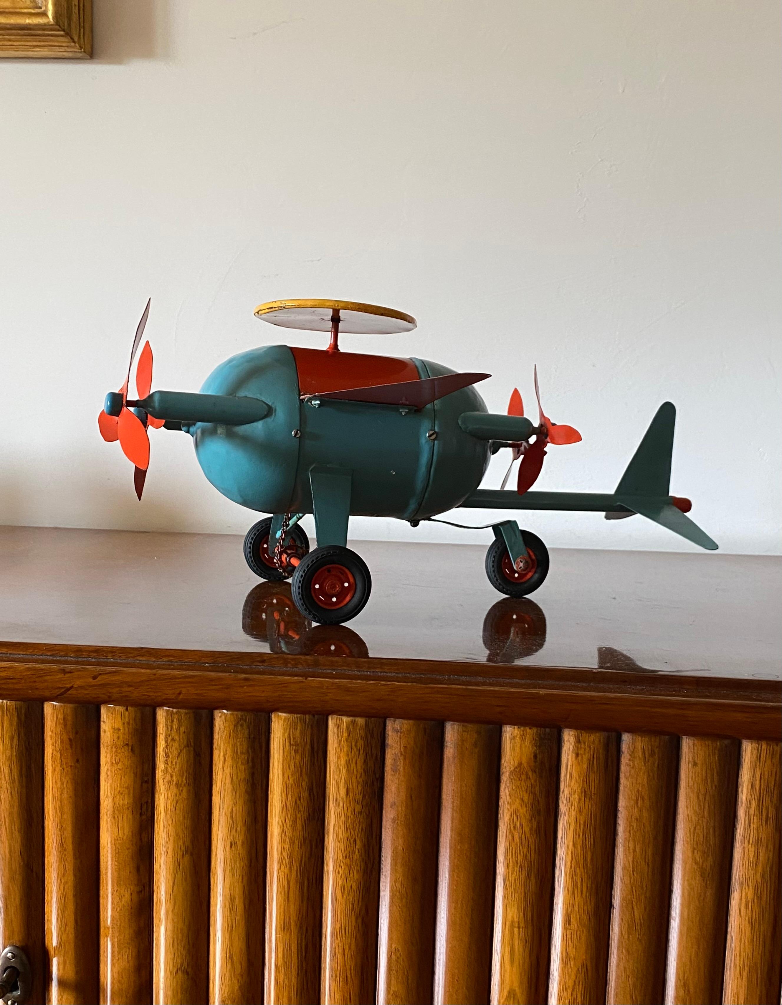 Red and blue airplane toy

France early 20th century

H: 18 cm - 44 x 37 cm

Conditions: excellent. No defects.